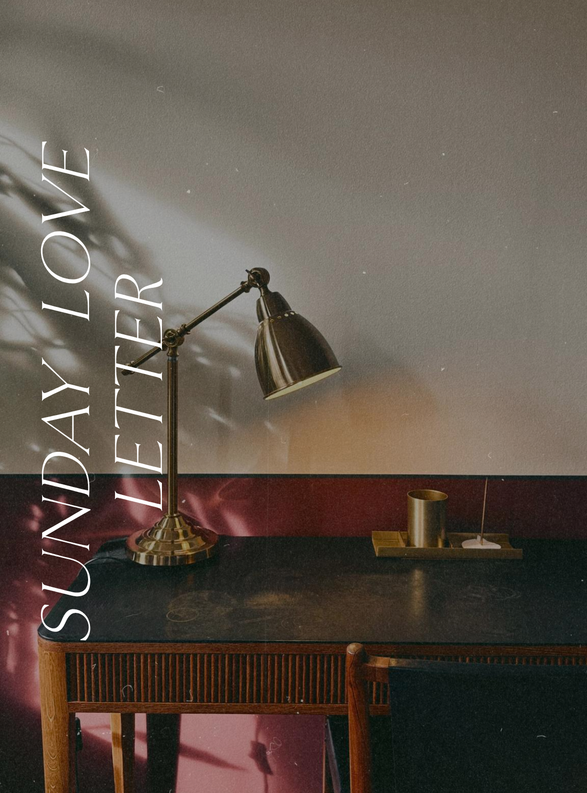 Sunday Love Letter cover featuring a vintage wooden desk with a brass reading lamp, and warm afternoon light casting soft shadows across the wall.