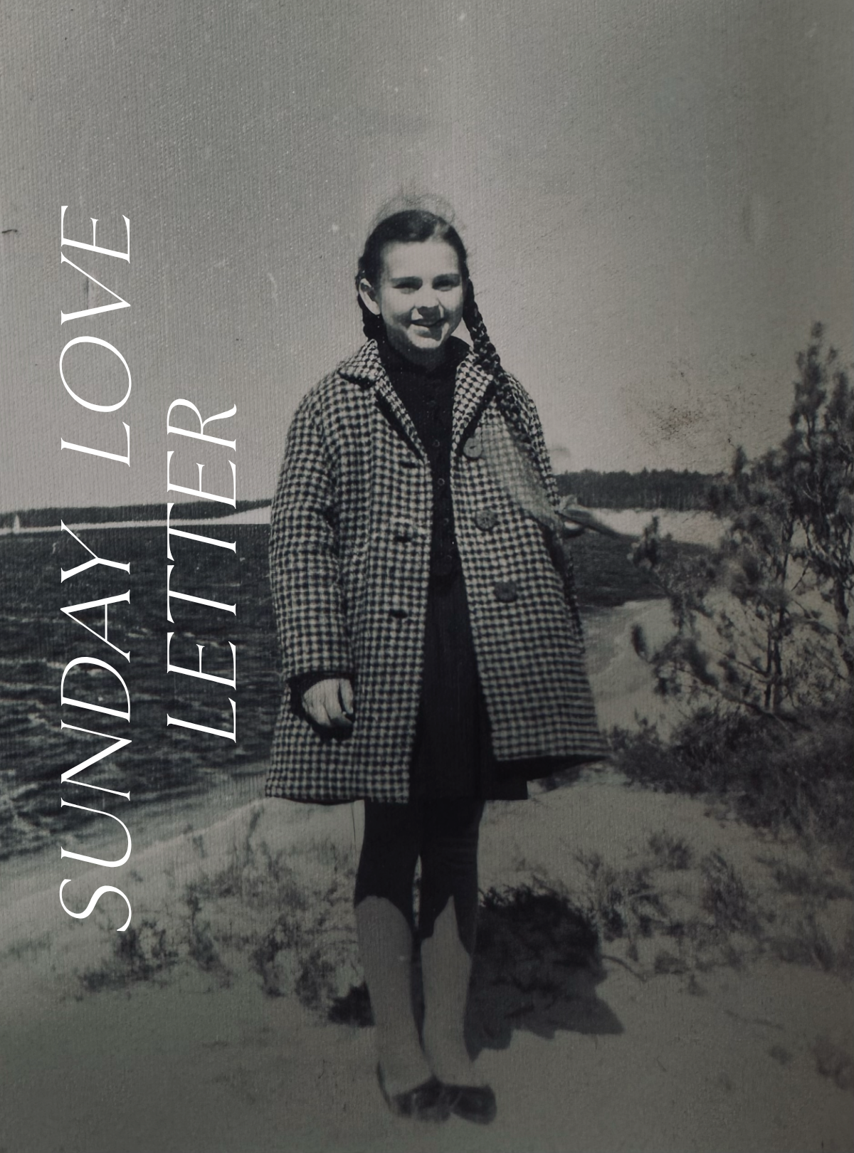 Sunday Love Letter cover featuring a vintage black and white photograph of Elina's mother as a young girl, wearing a checked coat with braided hair, smiling by the seaside.