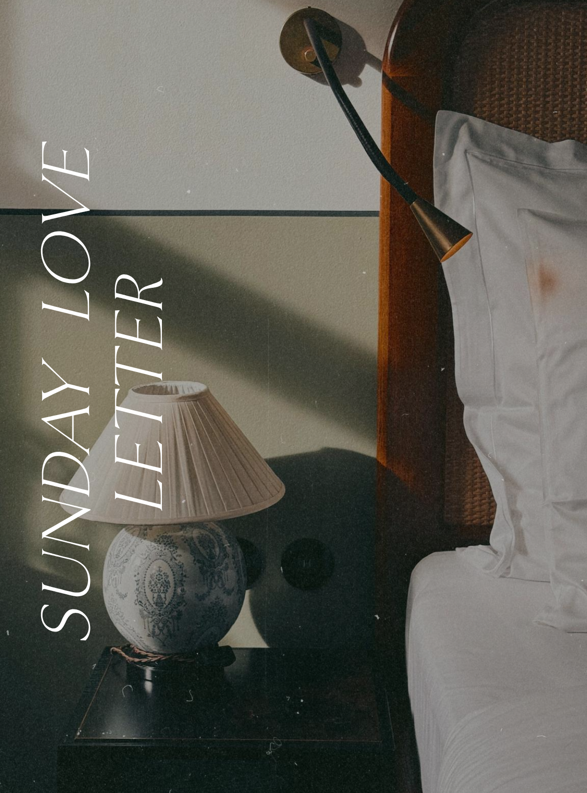Sunday Love Letter cover image featuring a moody bedside scene with a ceramic table lamp casting soft shadows, a reading light, and white hotel-style pillows against a wooden headboard.