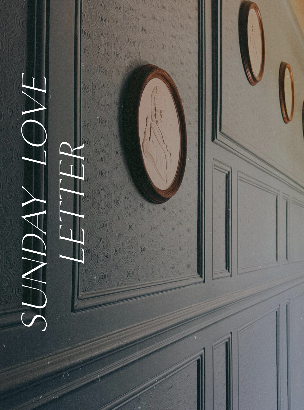 Sunday Love Letter cover featuring antique framed white relief portraits displayed on a forget-me-not blue panelled wall inside L'Abbaye des Vaux-de-Cernay.