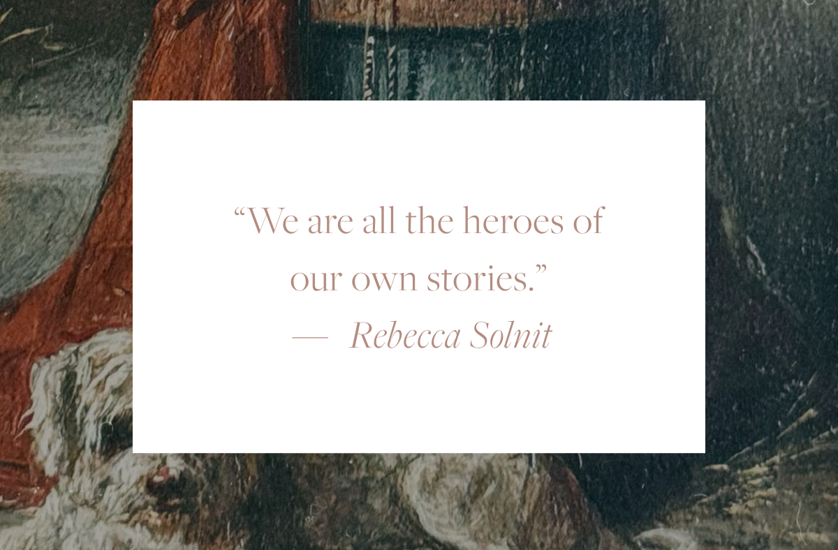 Quote card reading: "We are all the heroes of our own stories." — Rebecca Solnit, overlaid on a fragment of a 19th-century painting of a monkey in a red jacket perched on a barrel above a white Maltese dog.