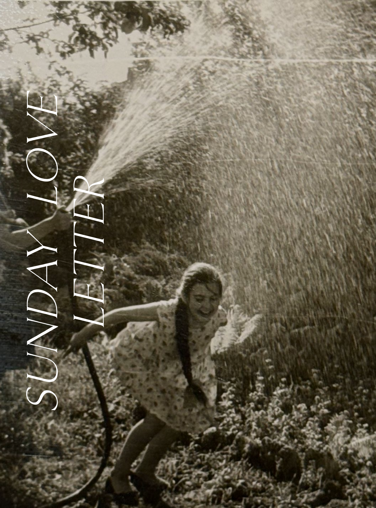 Vintage black and white photo of a young girl laughing in a garden sprinkler, with "Sunday Love Letter" text overlay.