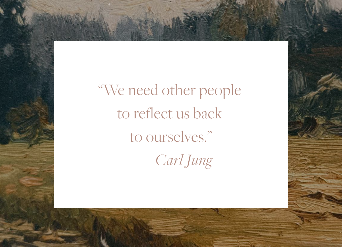 Quote card reading: "We need other people to reflect us back to ourselves." — Carl Jung, overlaid on a fragment of a landscape painting with a calm river reflecting a grassy riverbank and distant trees.