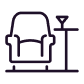 A purple armchair with a side table on its right