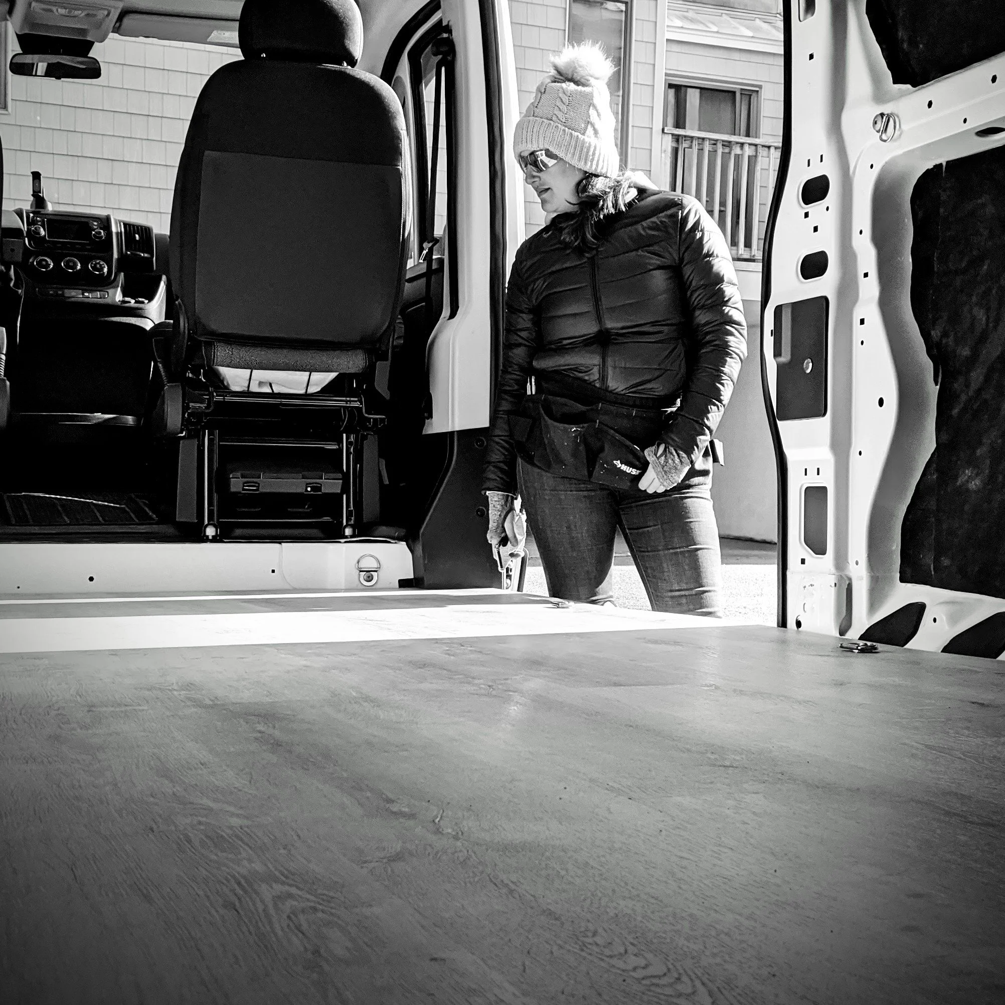Roamer Vans designer Maya inspecting an in-progress custom van conversion build