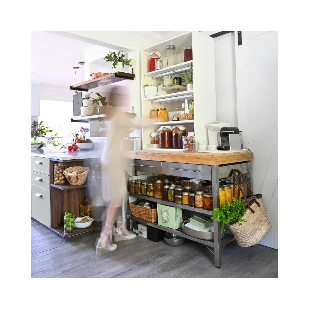 A woman stands in front of a kitchen pantry, examining the shelves filled with various food items and containers.
