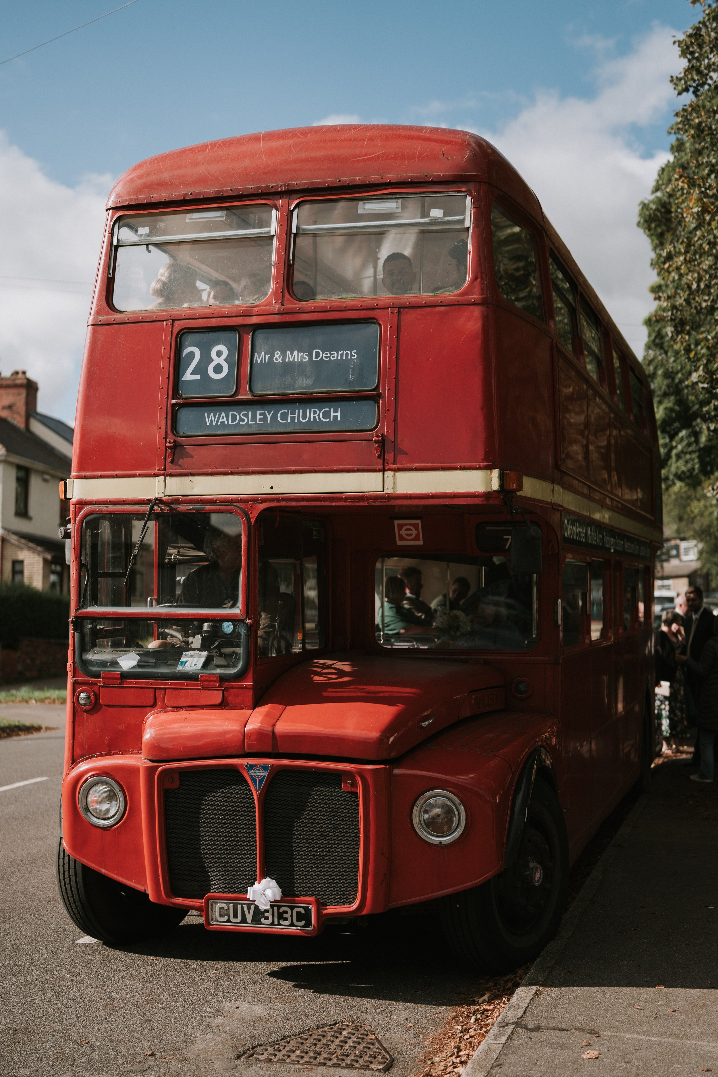 Red vintage double-decker bus with destination sign "Wadsley Church" and number 28 on display.
