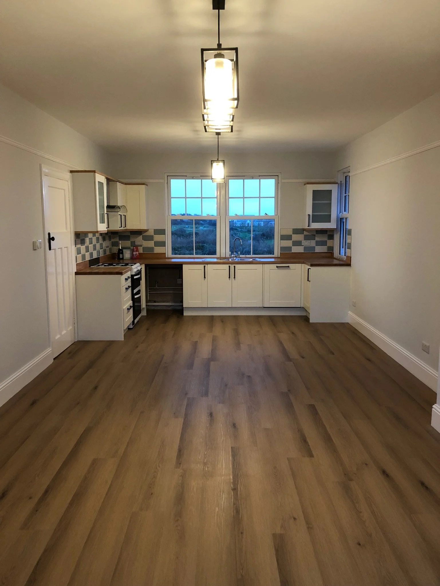 A finished kitchen and dining room