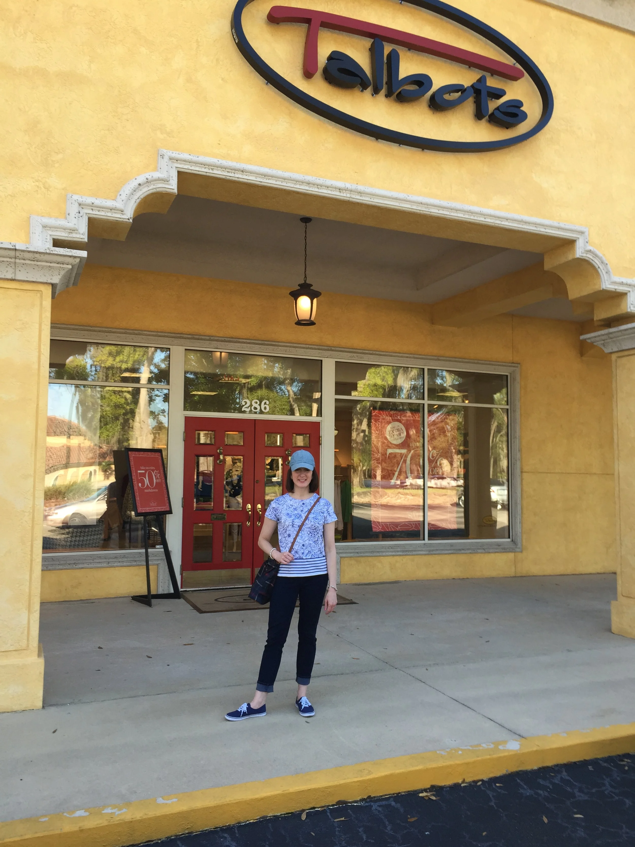 standing outside at boutique