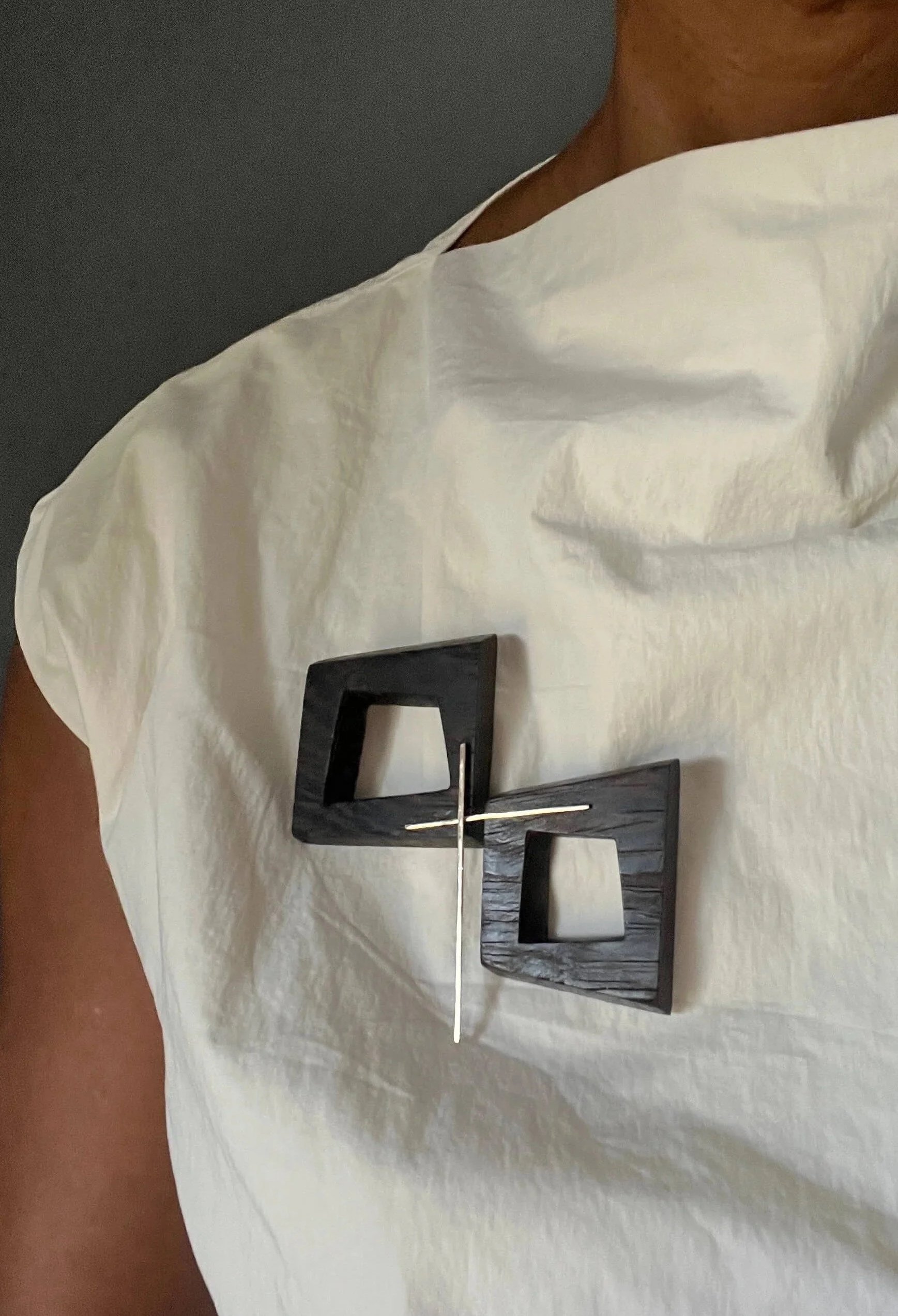 modernist mixed media brooch on cotton blouse