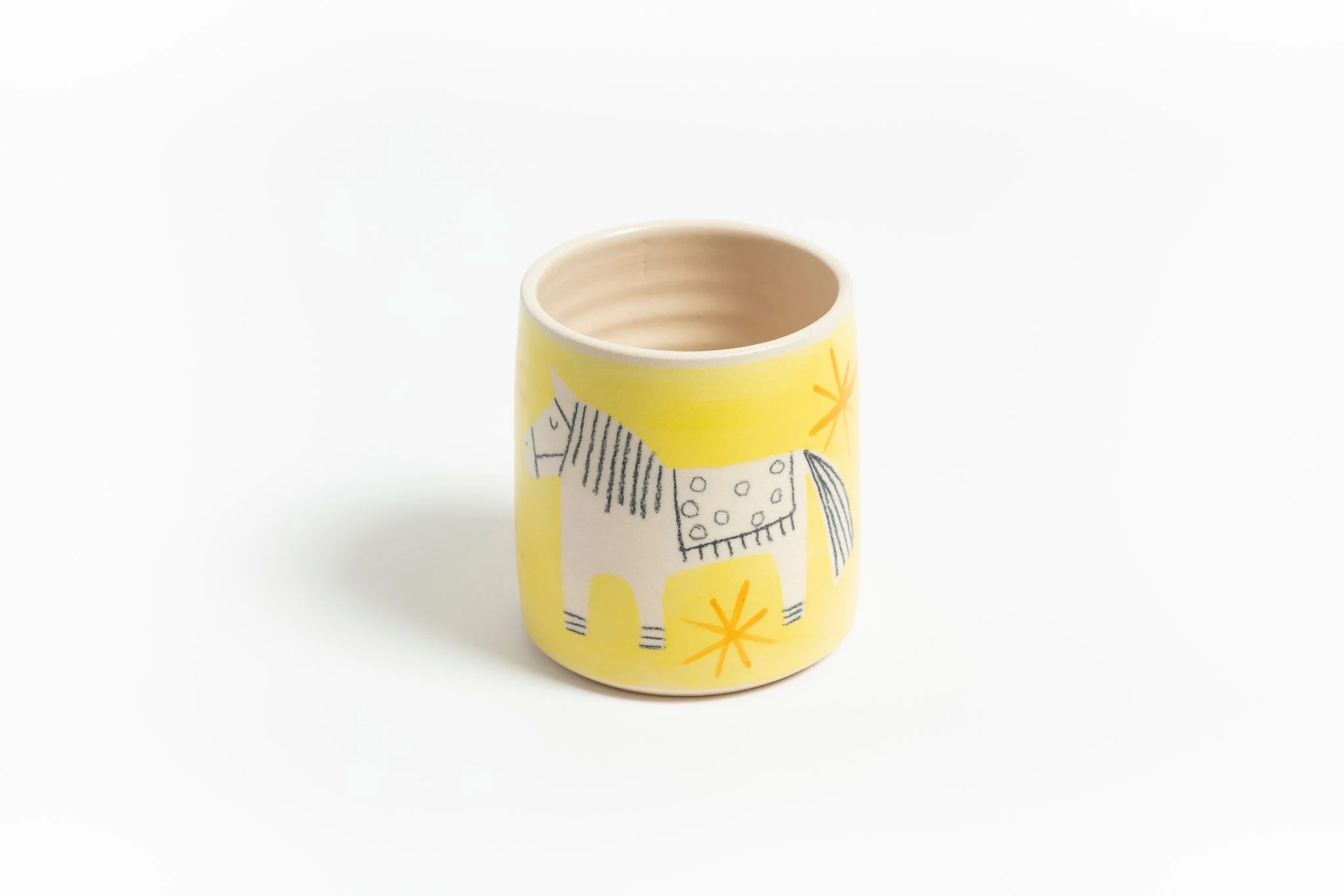 Meet the daffodil yellow Party Pony! Shop our spring collection in a limited collection of designs handmade in Cornwall by @lauralaneceramics and filled with any of our range of fragrance blends. 
From the orange blossom and tuberose of no1 Dip to th