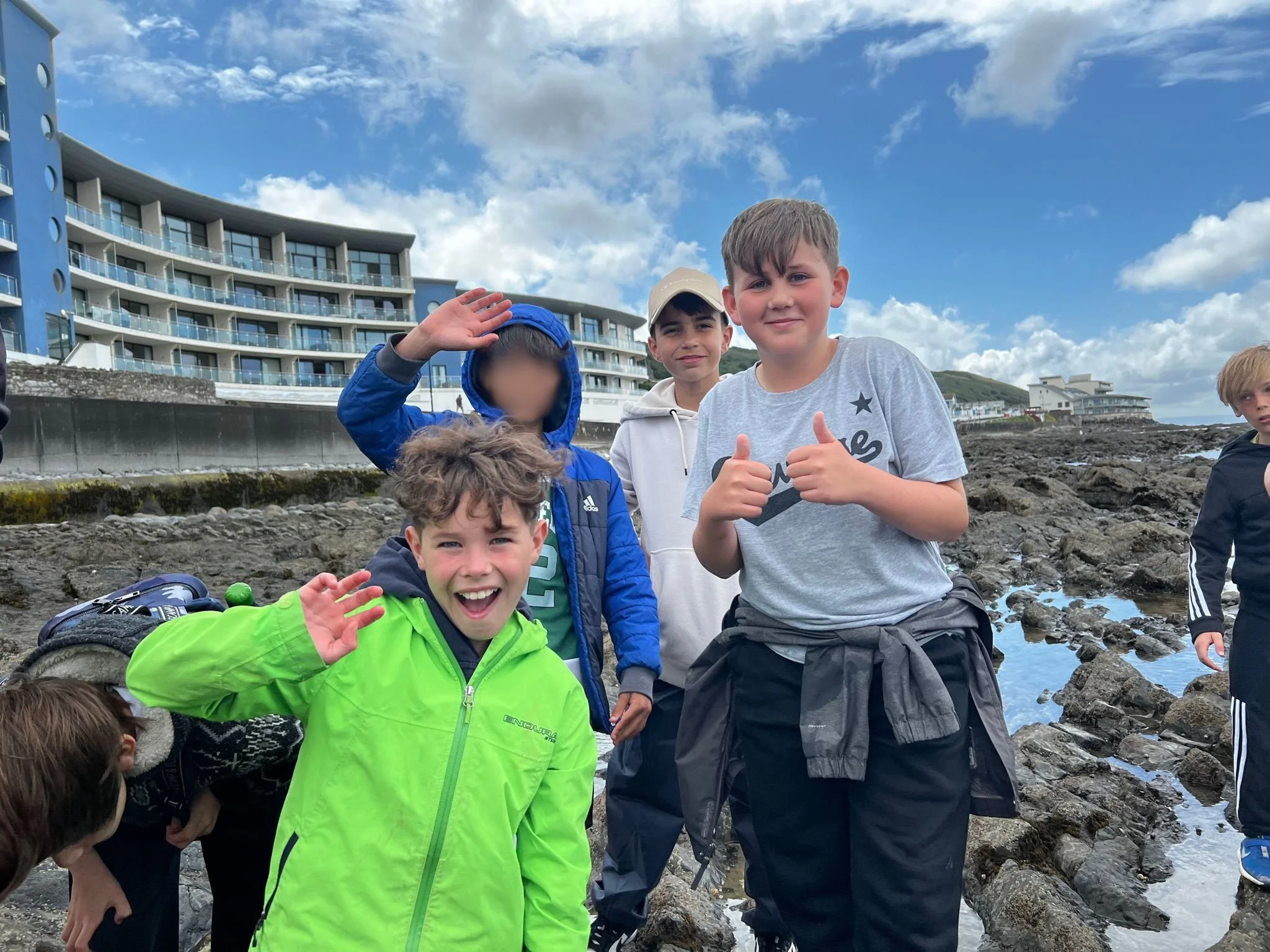 Please blur the face of the child in the blue coat.jpg