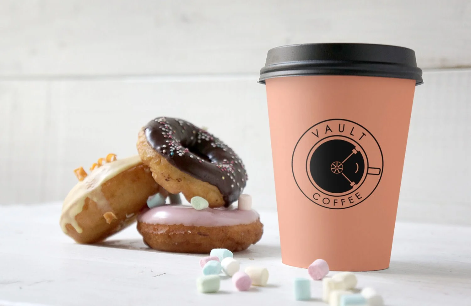 mockup-of-a-paper-cup-next-to-some-donuts.jpg
