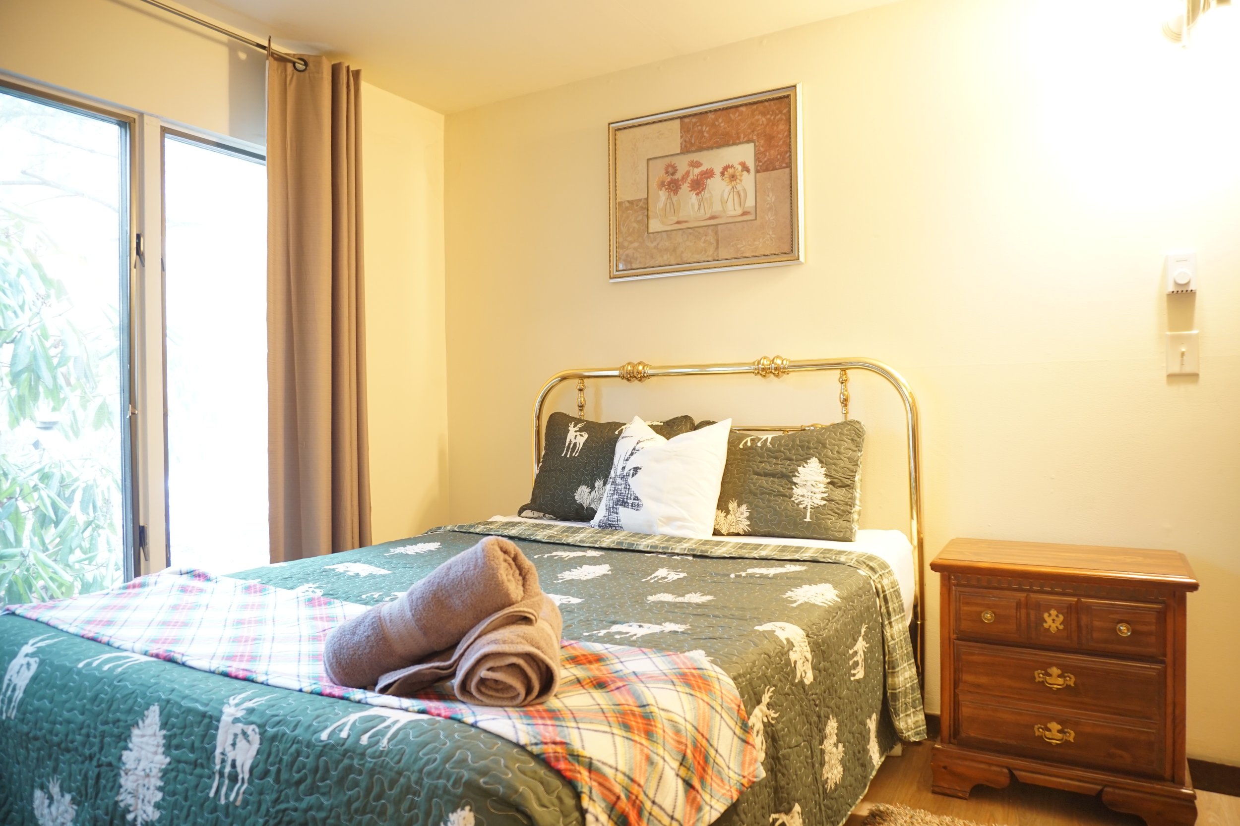 First floor main bedroom with queen bed