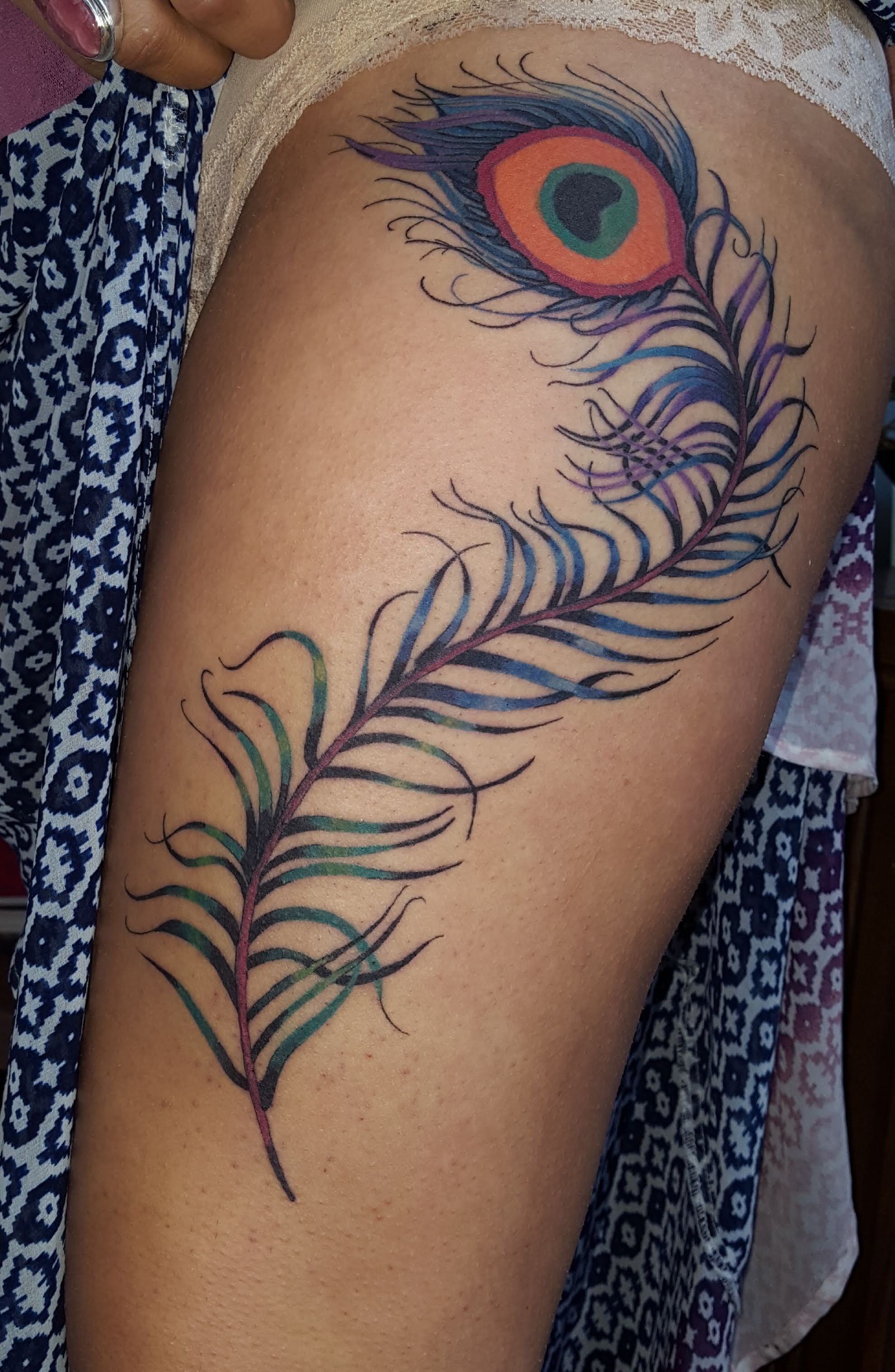 14 Beautiful Peacock Feather Tattoo Ideas for Women in 2024