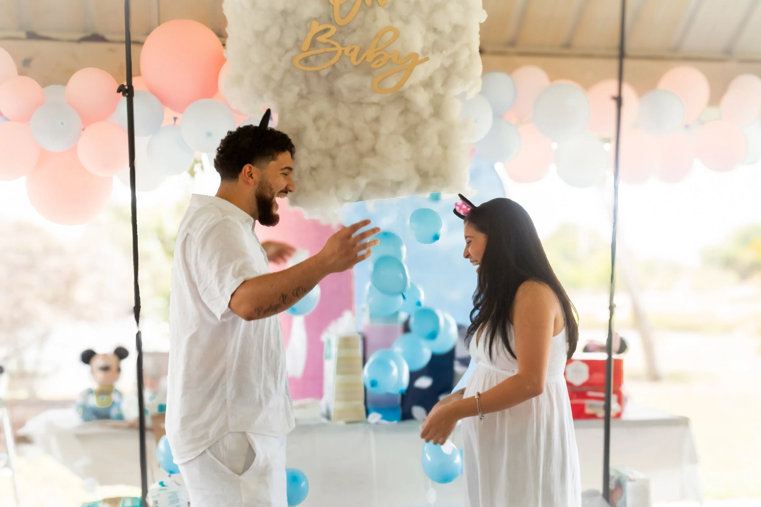 Gender reveal photography capturing joyful moments and meaningful celebrations with family and friends.