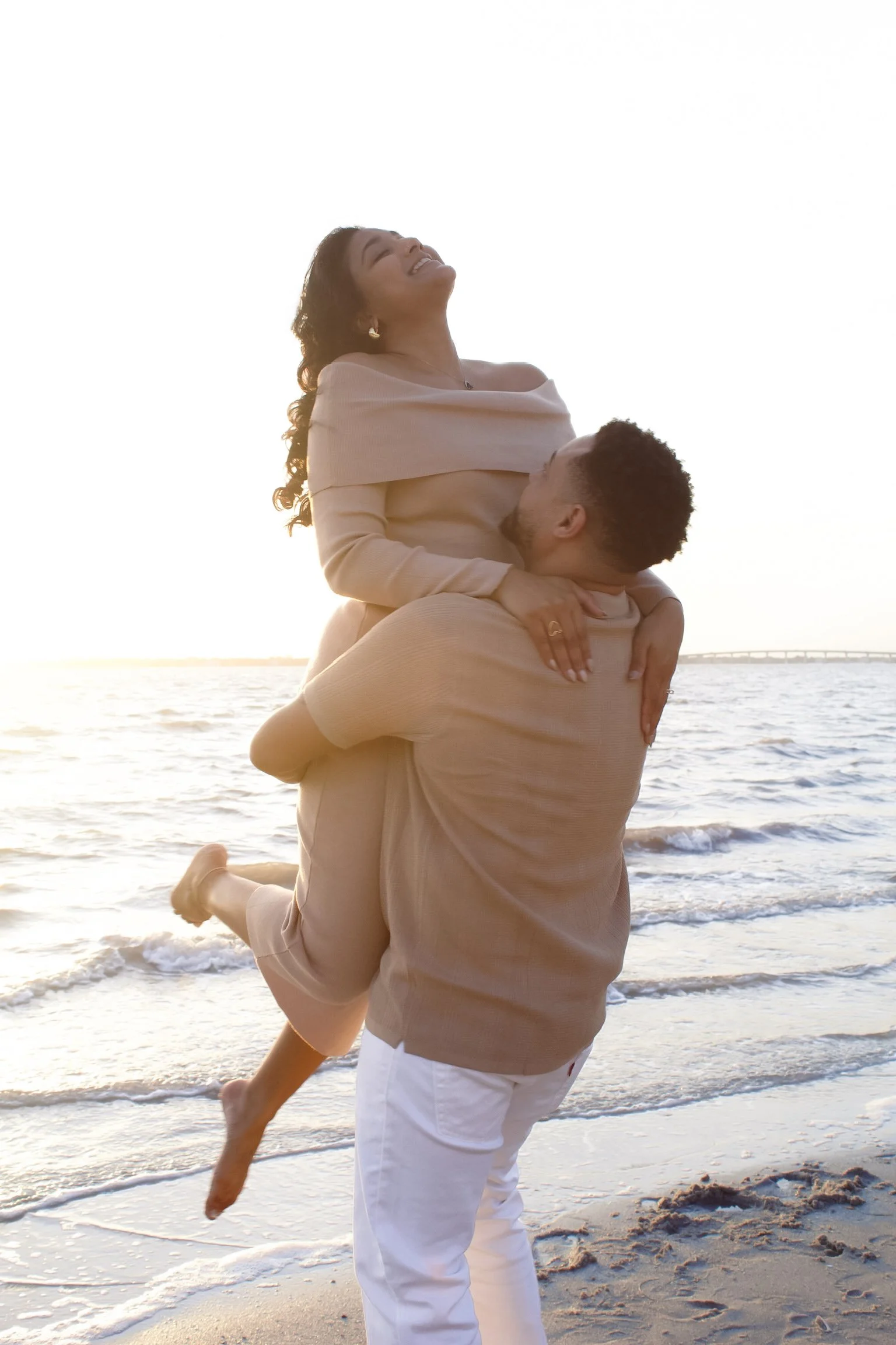 Romantic couples photography session on a Florida beach at sunset capturing authentic connection and emotion.