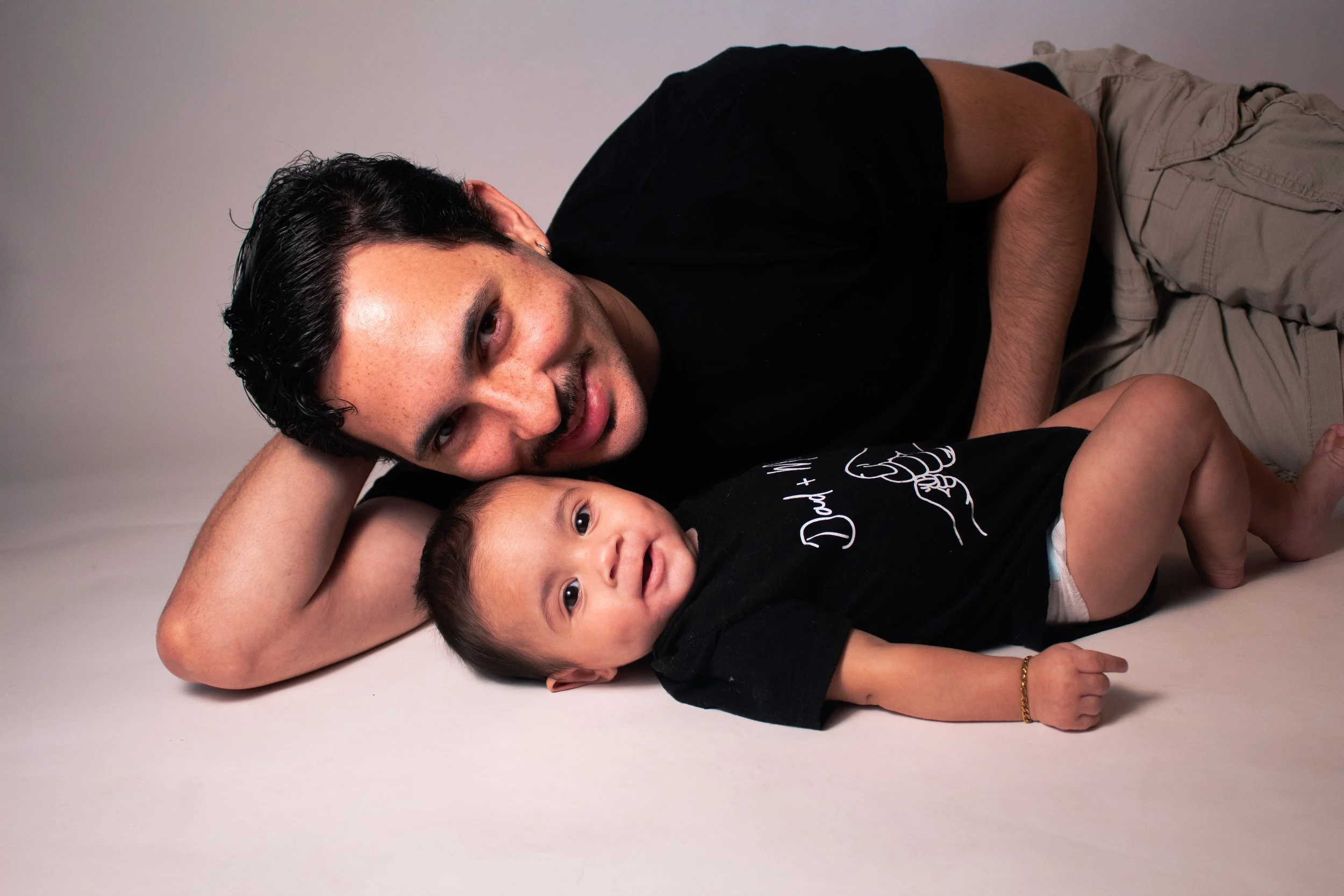 Father and baby portrait photography capturing the bond between parent and child through timeless imagery.
