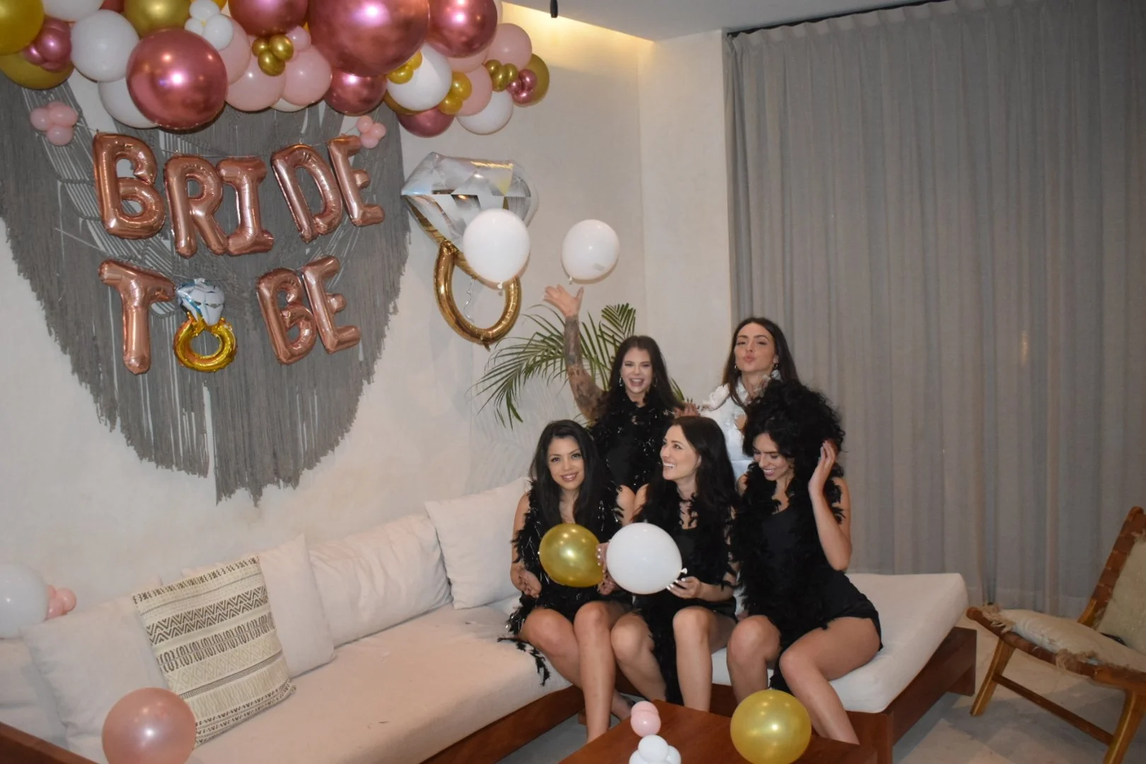 Celebrating a bachelorette party with a private chef and a large decorative diamond-shaped balloon.