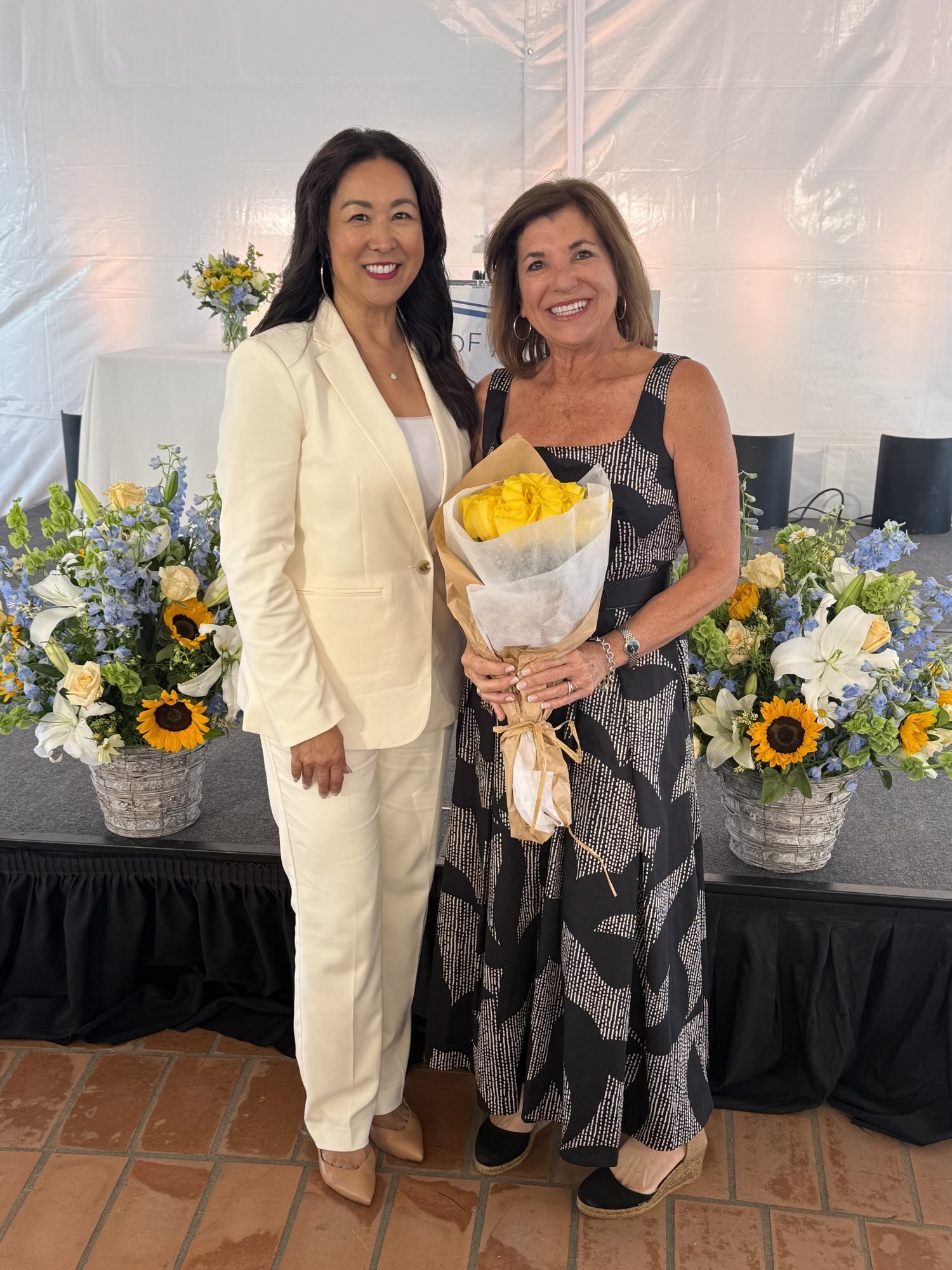 Marybeth Carty receiving flowers at the Santa Barbara Foundation Person of the Year luncheon