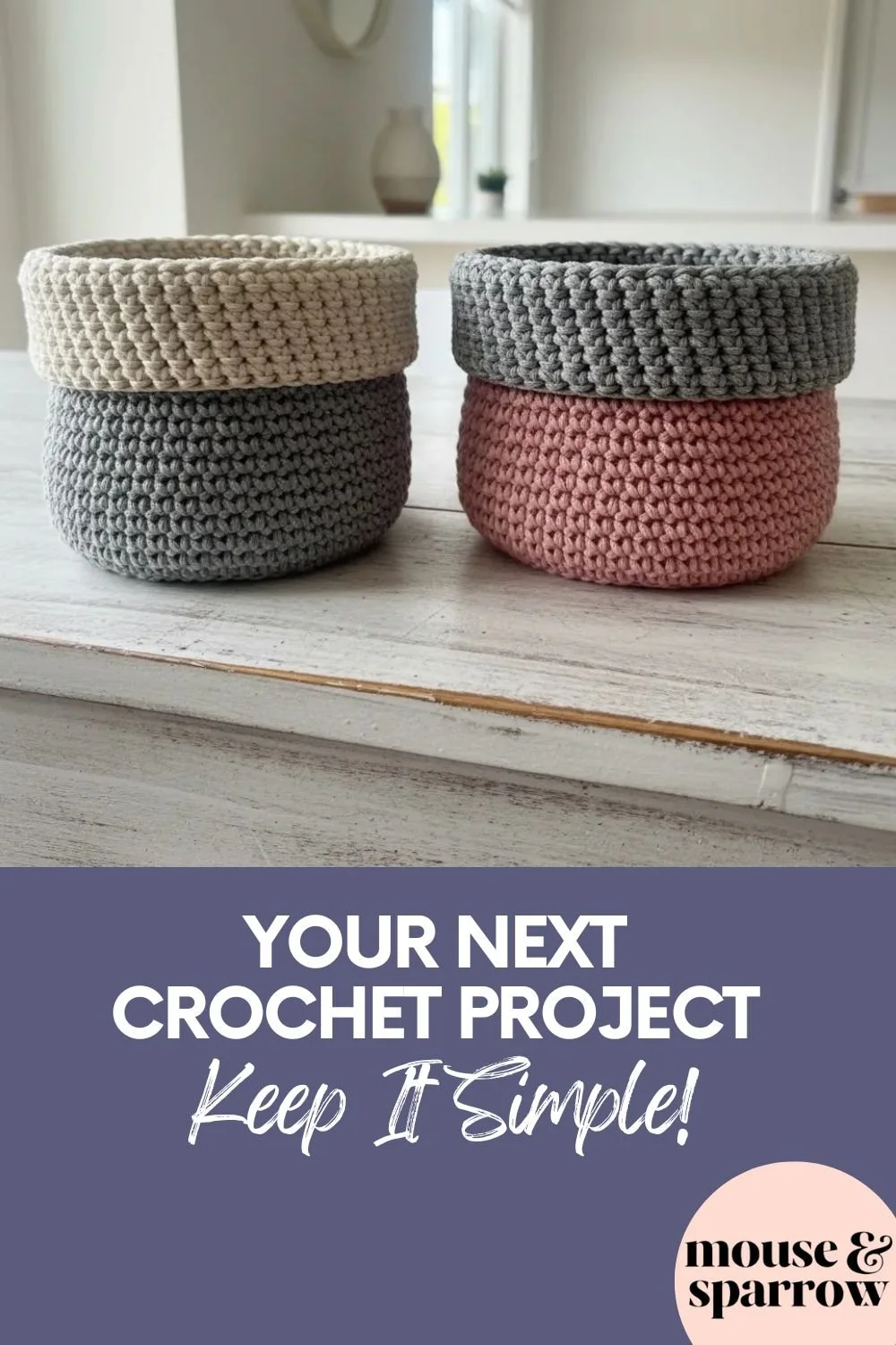 Small two-tone crochet basket with folded edge on a wooden shelf for home storage