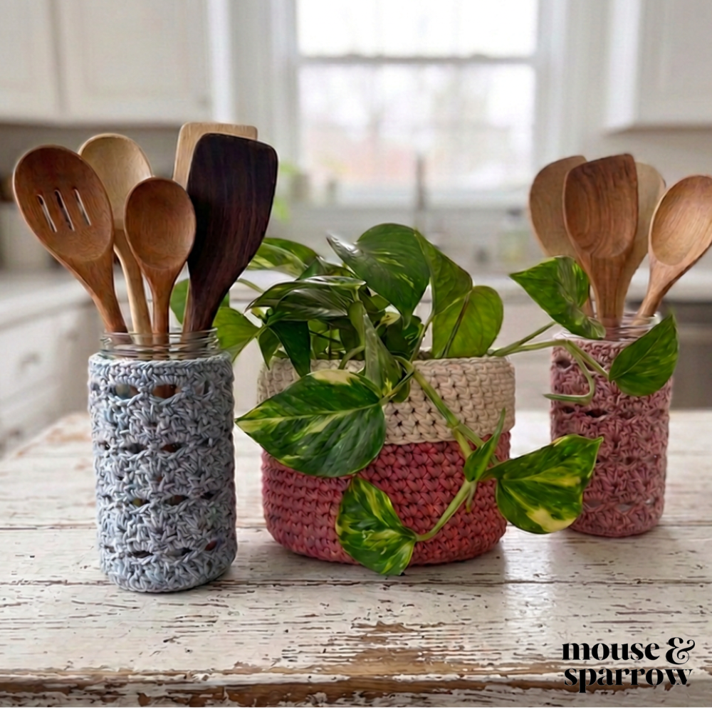 crochet jar covers used as utensils on a kitchen tablw