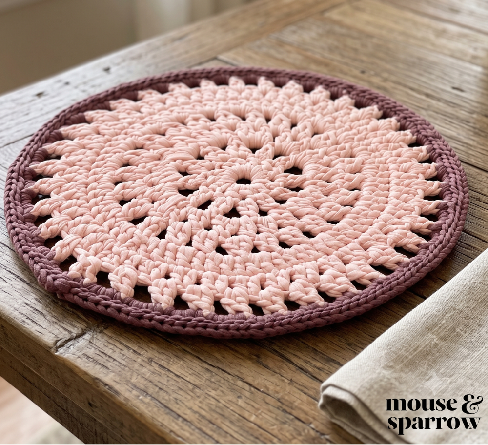 round crochet placemat on a wooden kitchen table