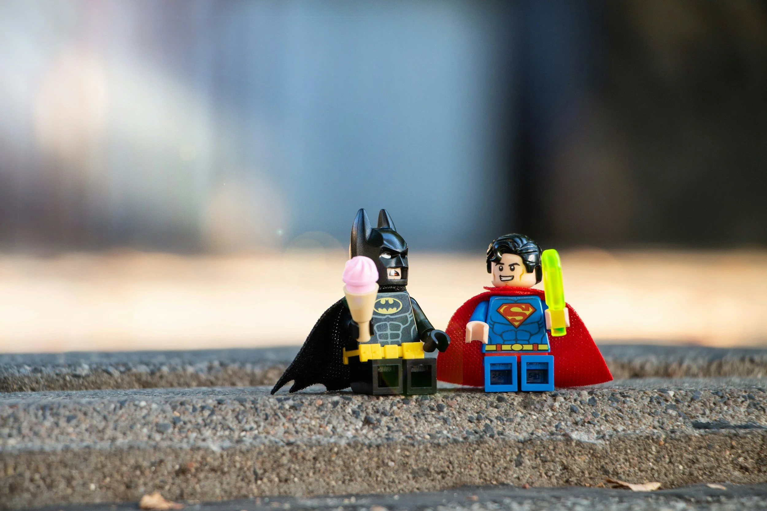Two fictional character figurines looking like they're sharing a snack