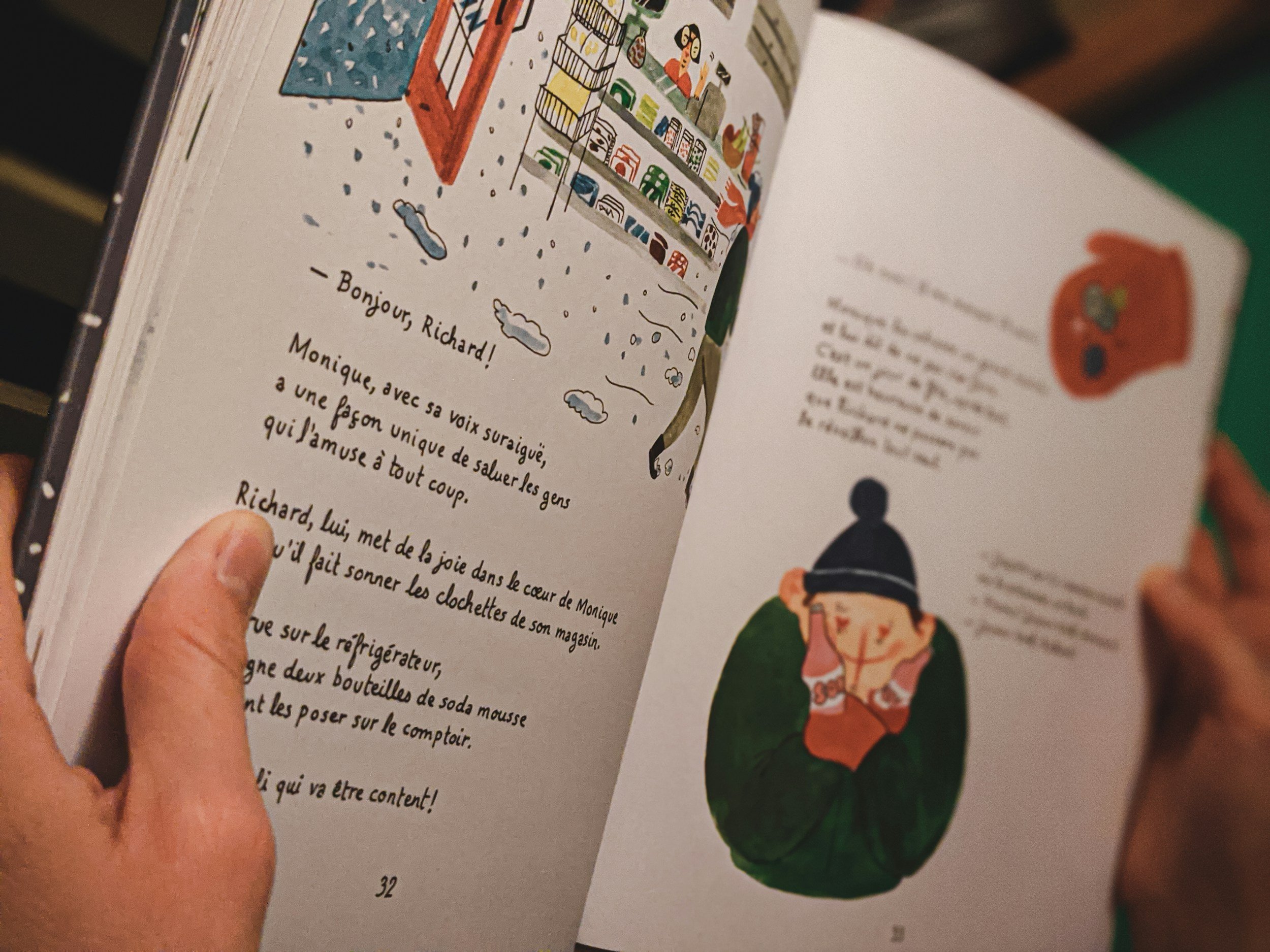 Person observing characters in a book