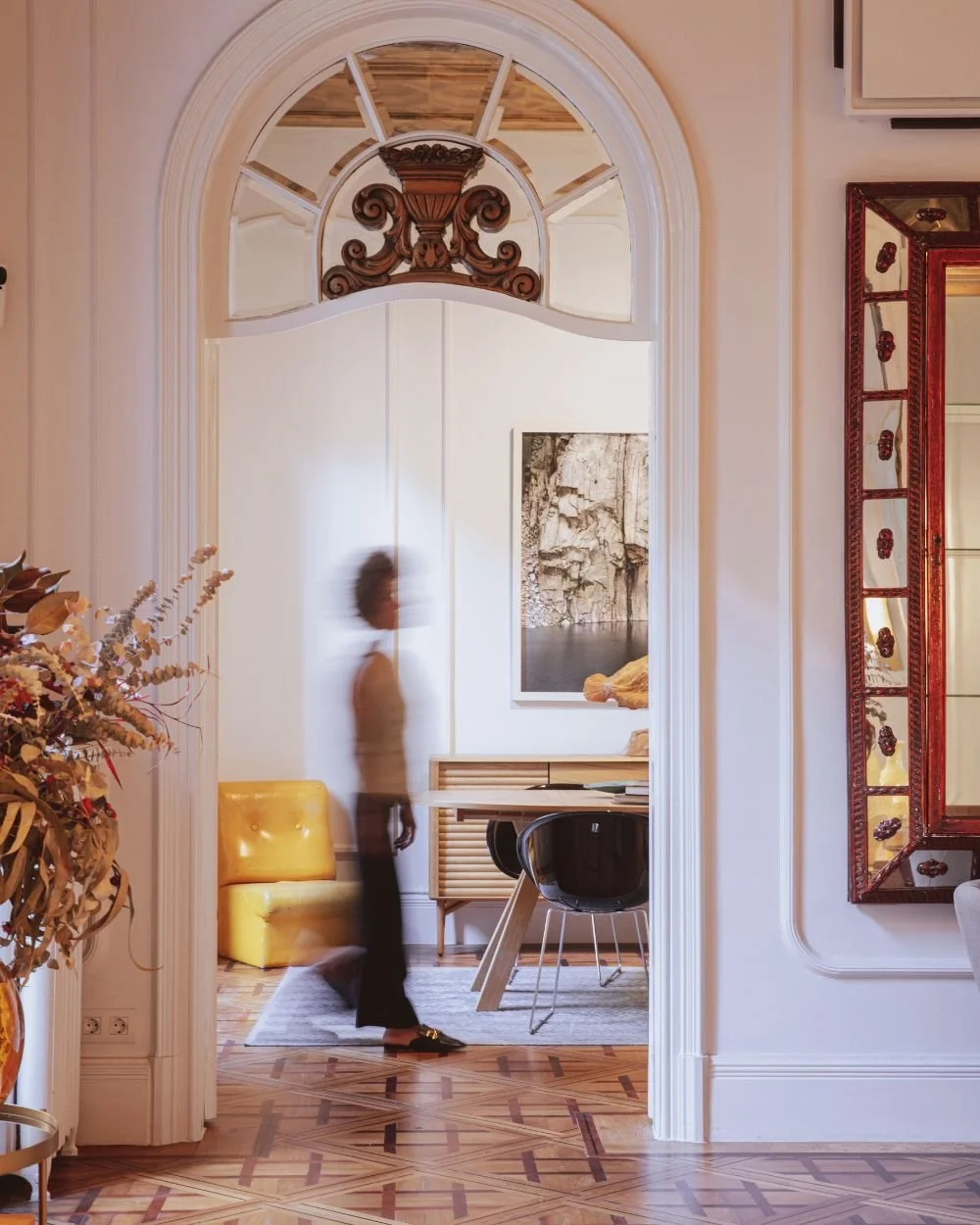 Woman walking through a sunlit home, symbolizing the search to feel like enough despite outward success