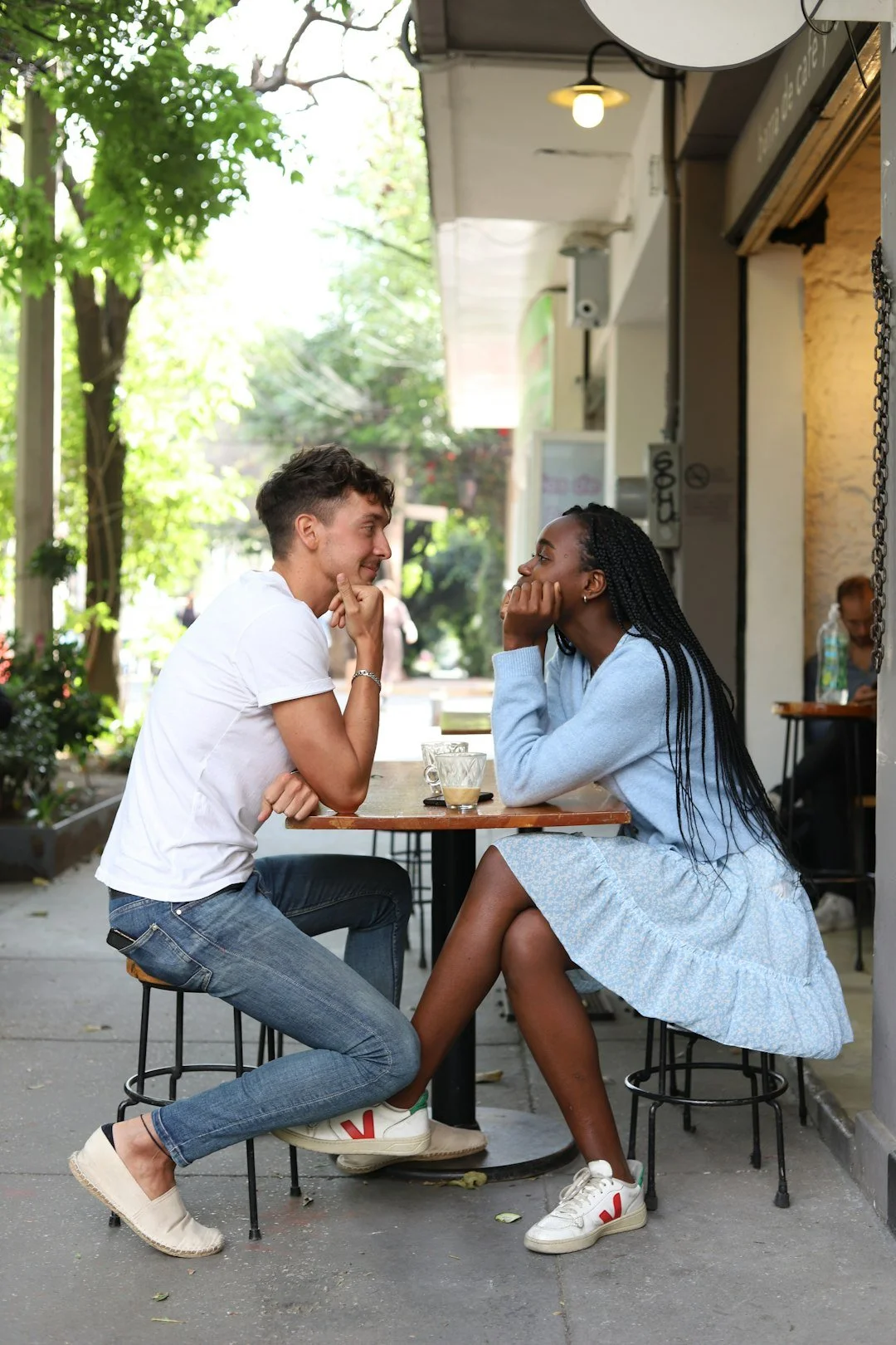 Couple sitting at table having meaningful conversation about dating and relationship boundaries