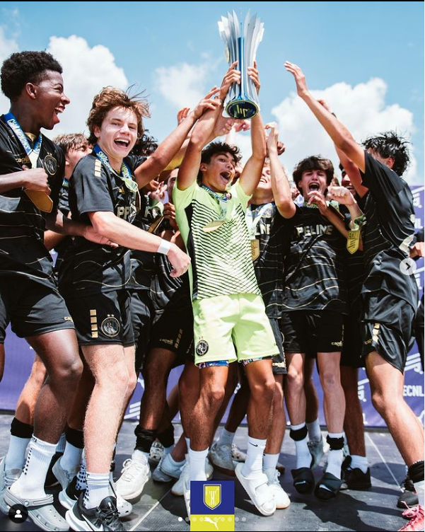 Boys Team Celebrate Trophy.png