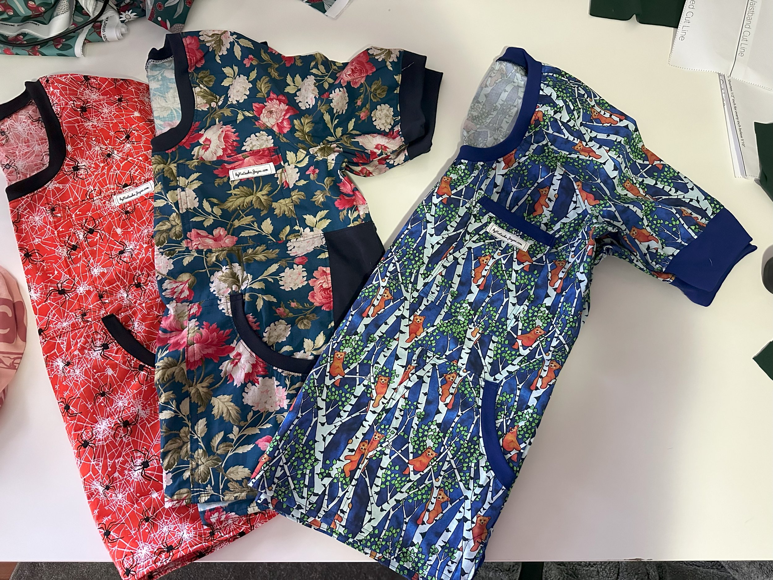 Scrub tops bears_navy flowers_spidered for website.jpeg