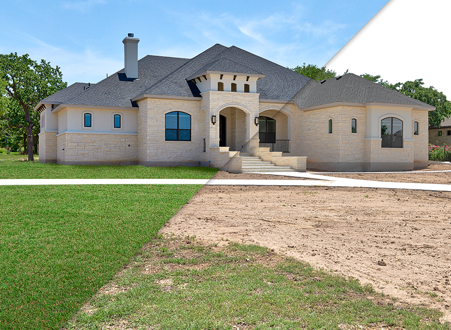 Newly constructed large house with light-colored brick exterior, dark gray roof, and multiple windows, situated on a partially landscaped lot with a front walkway and stairs.