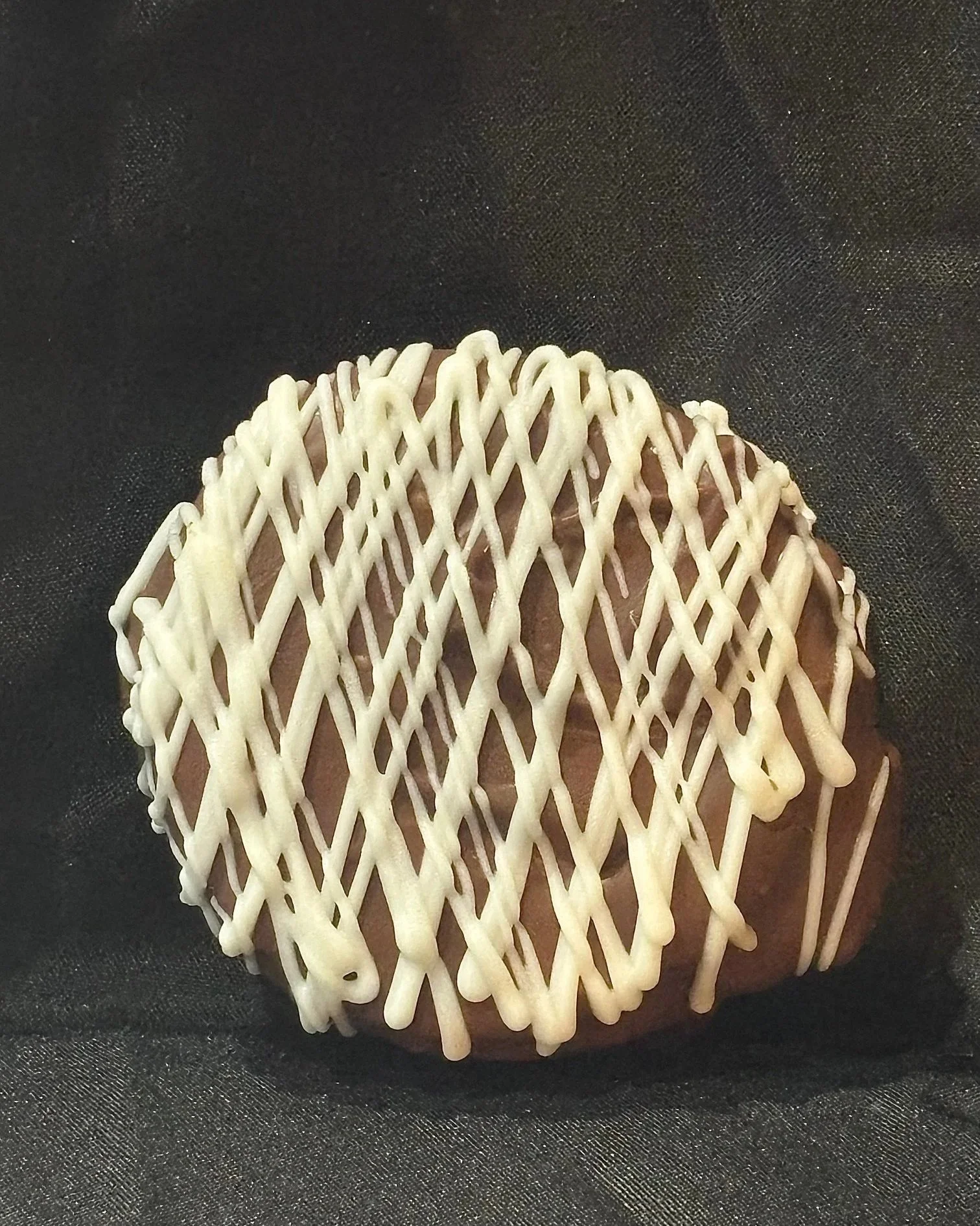 A single Marshmallow Pie set in front of a black background