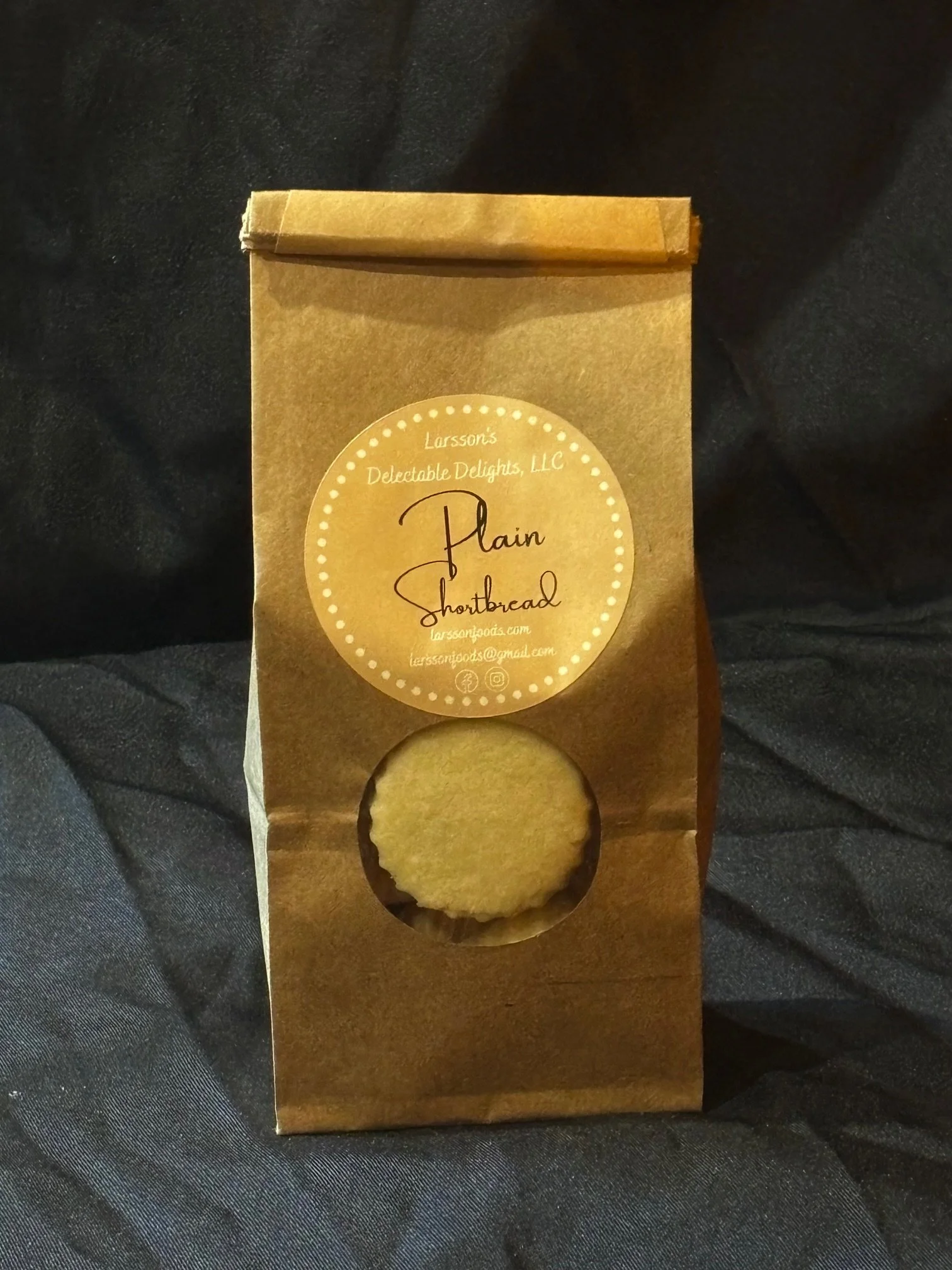A bag of mini Plain Shortbread set in front of a black background