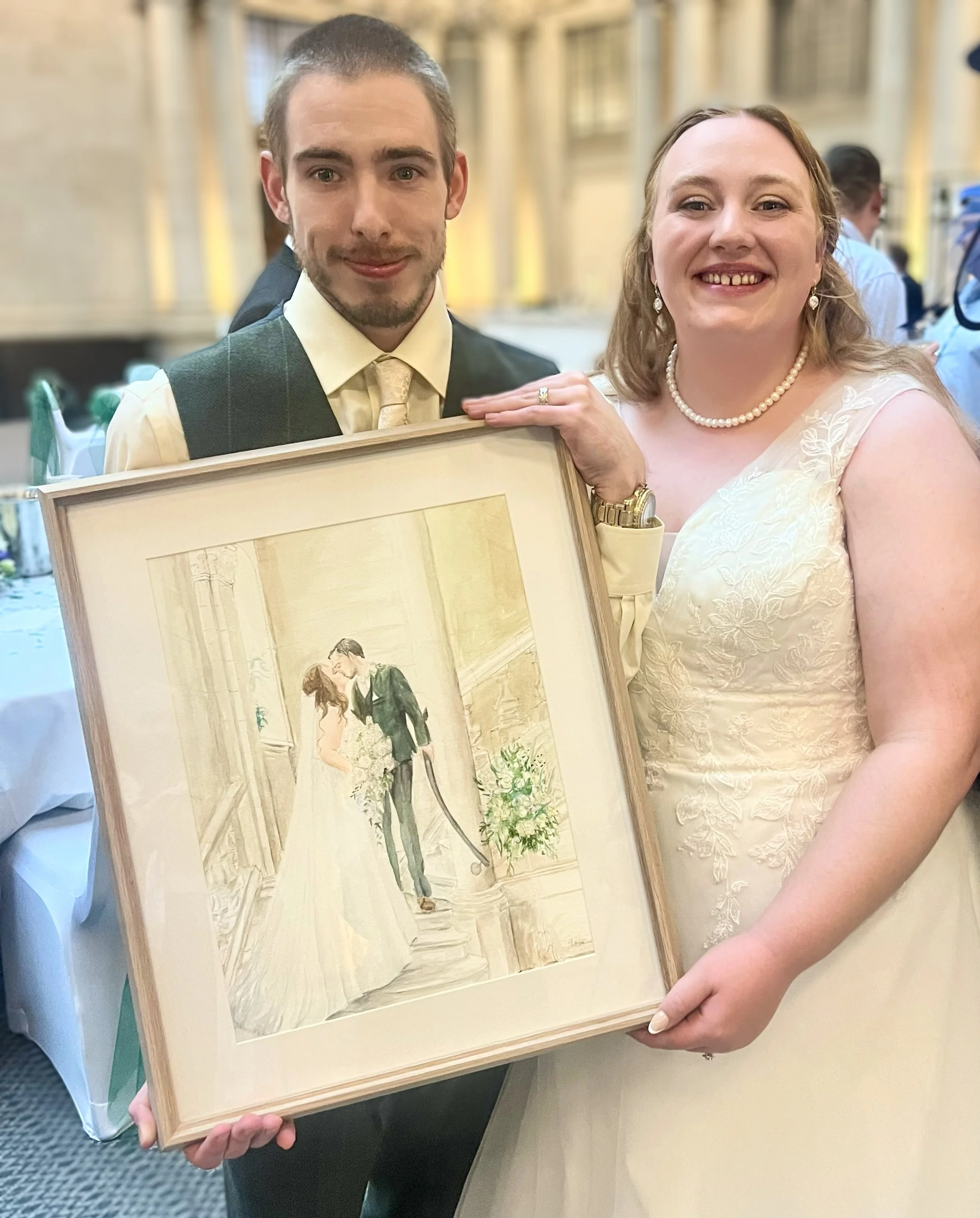 bride and groom receive their live wedding painting at Bristol wedding venue