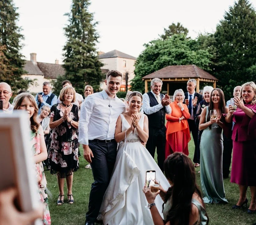 bride and groom react to live wedding painting reveal in  Southwest UK