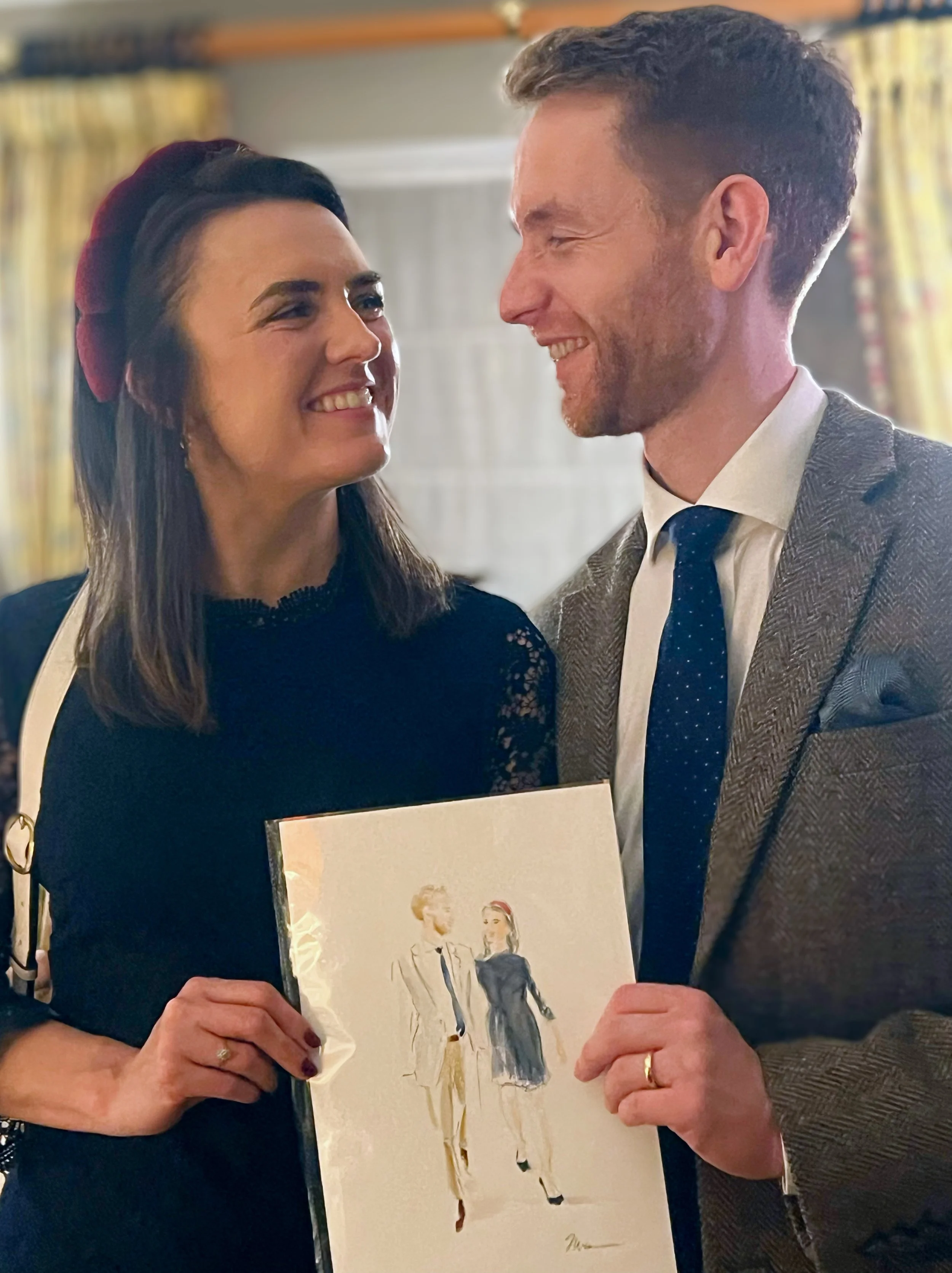 wedding guests smiling holding their couture live fashion illustration in London