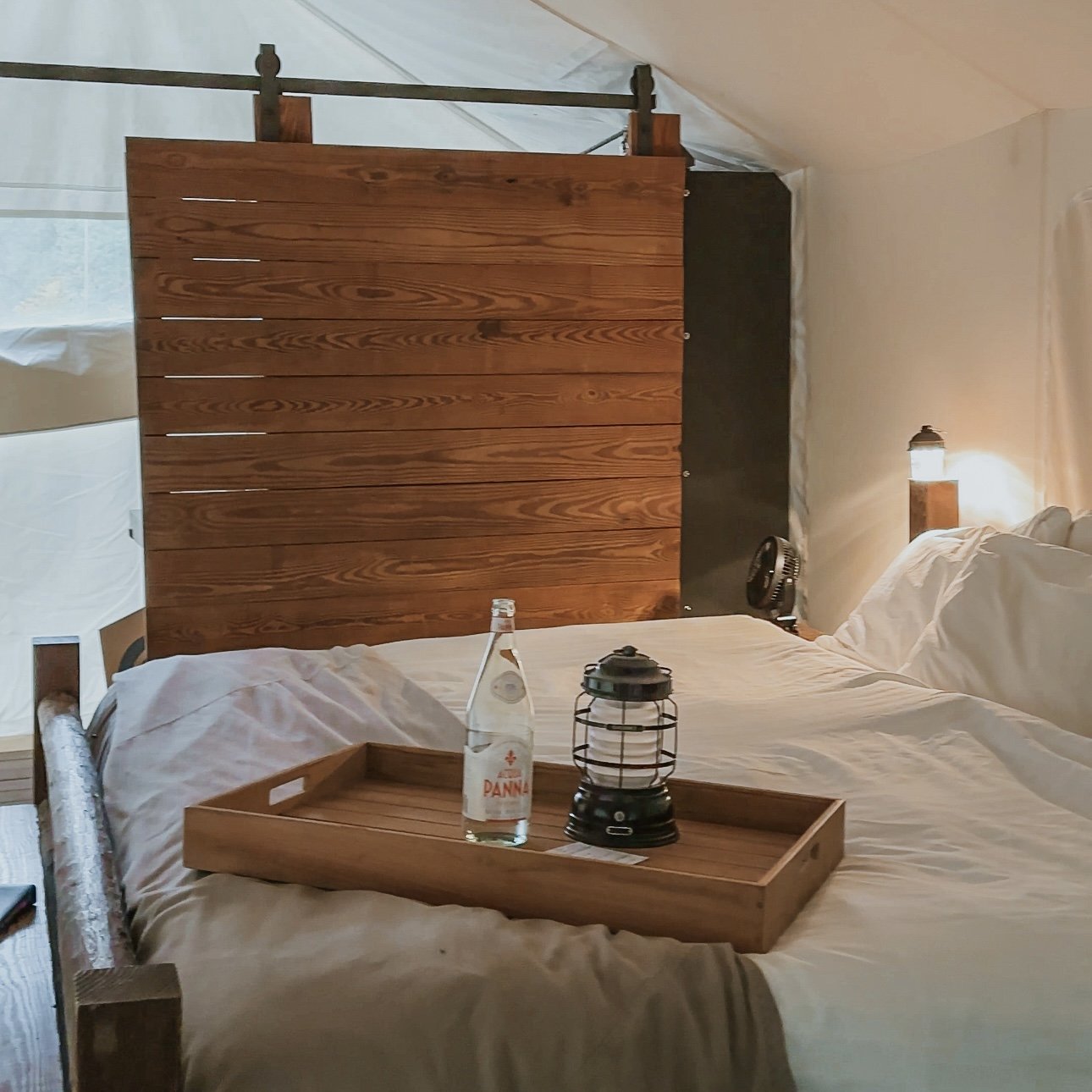 King bed inside a Deluxe tent at Under Canvas Great Smoky Mountains