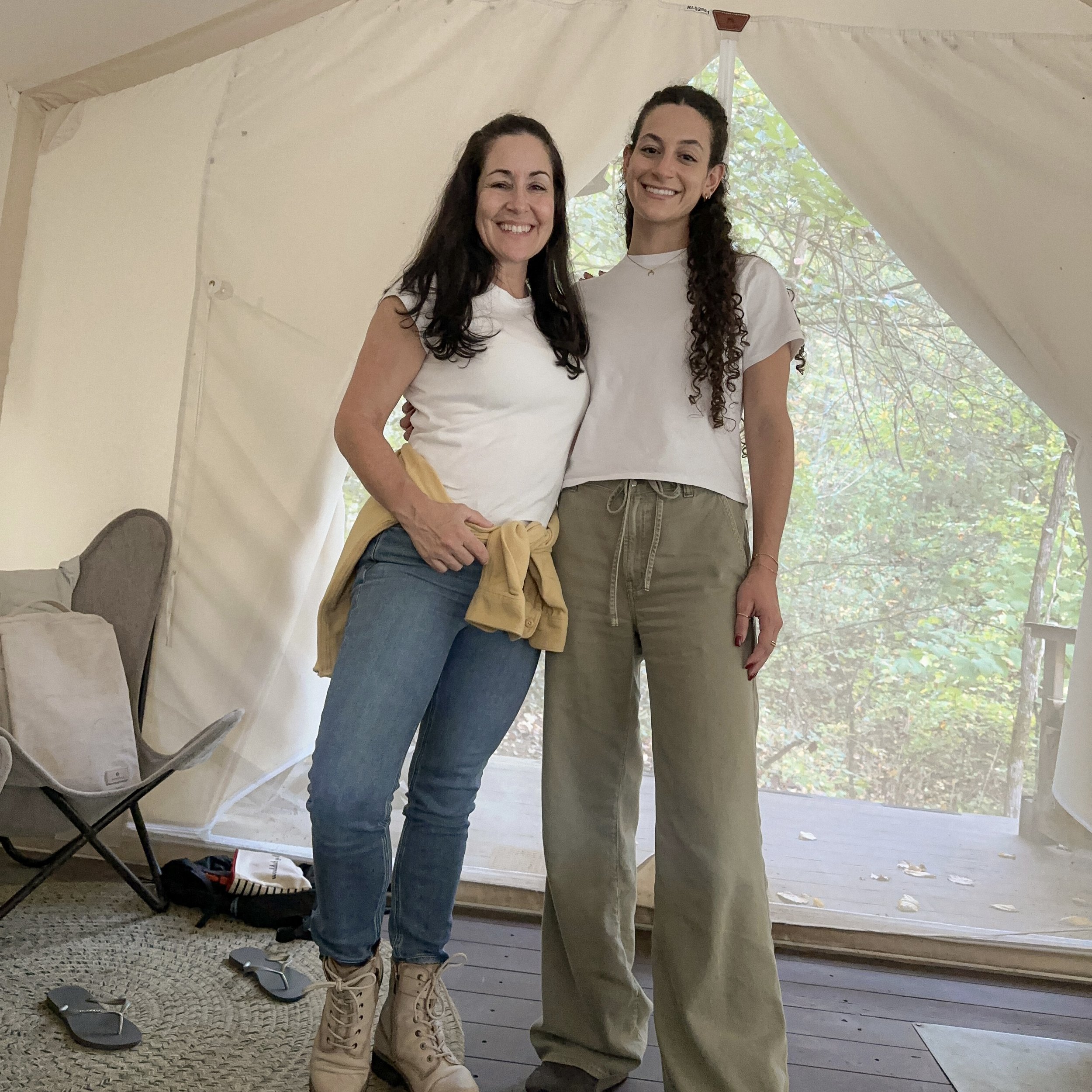 Mother and daughter inside their glamping tent at Under Canvas