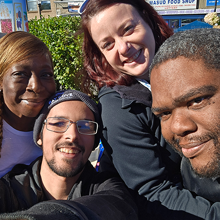 Bay Cove staff and the people we serve enjoying the Boston sunshine i