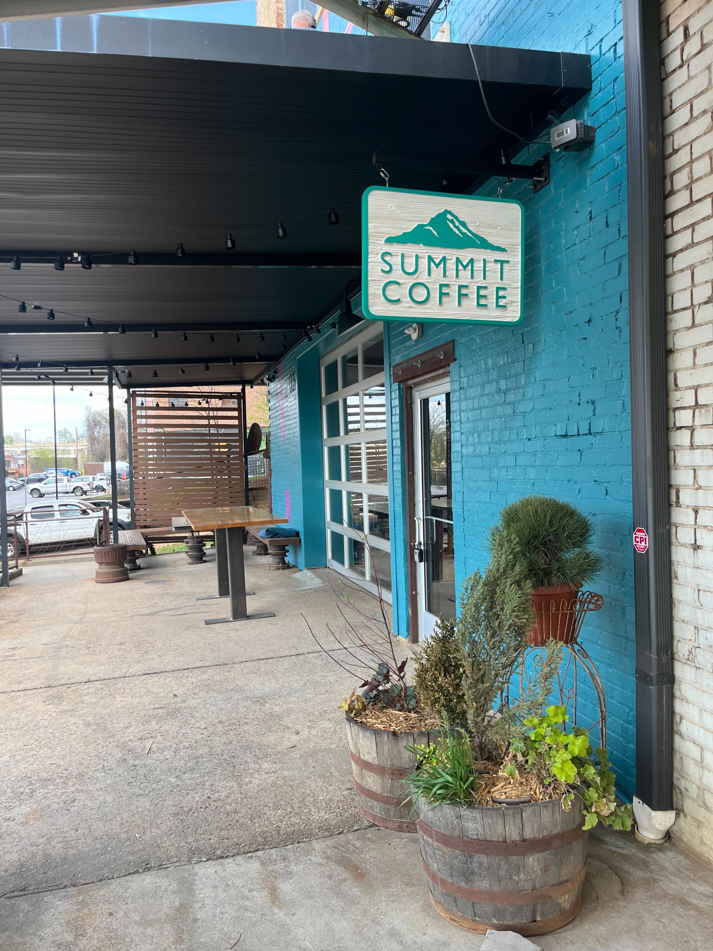 blue building with summit coffee signage hanging off the wall