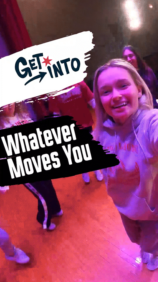 Person using a stylus to interact with an educational website projected on a whiteboard in a classroom setting.