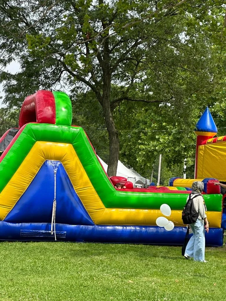 A picture of bouncing houses in the festival.