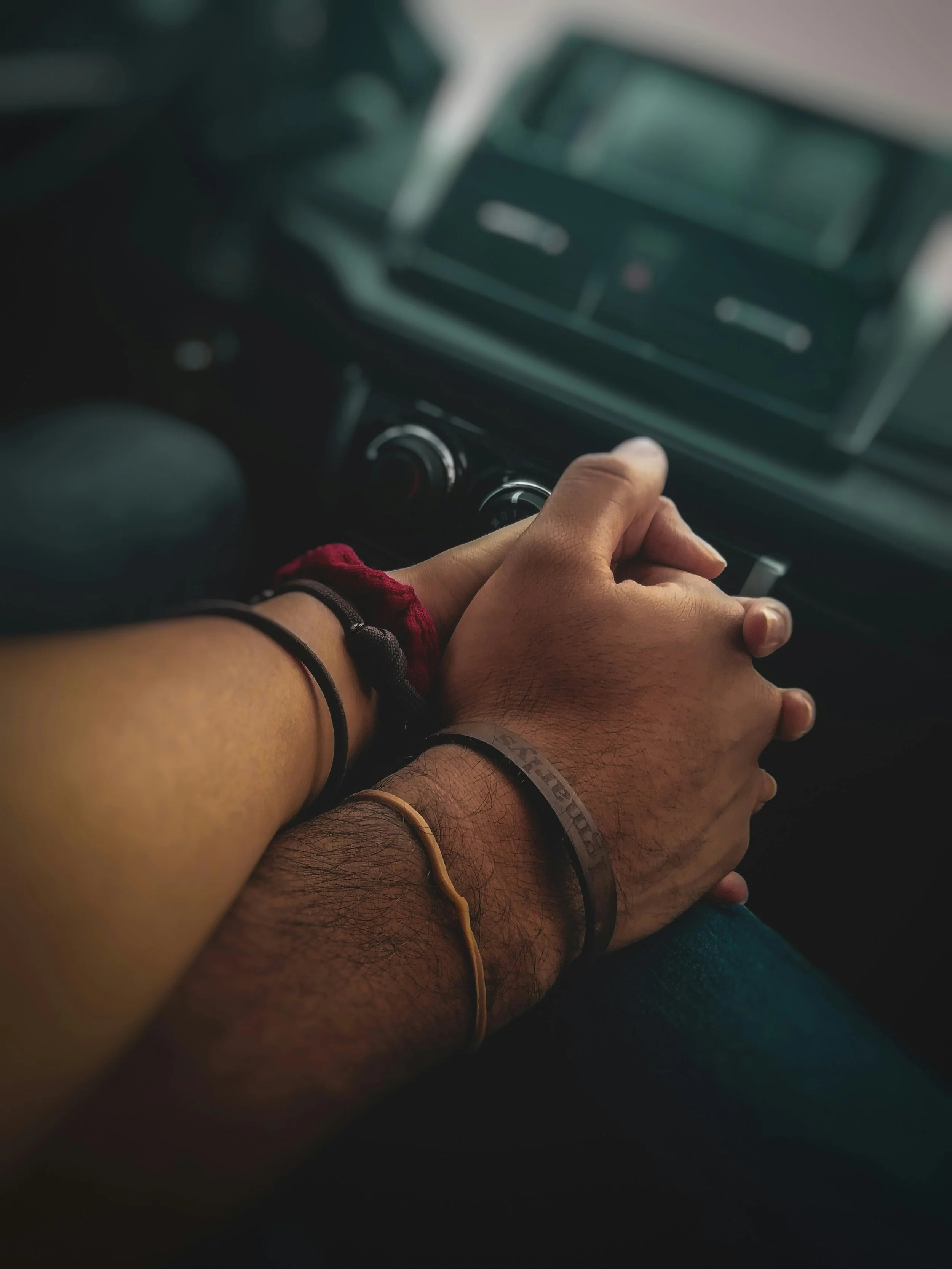 Two people holding hands