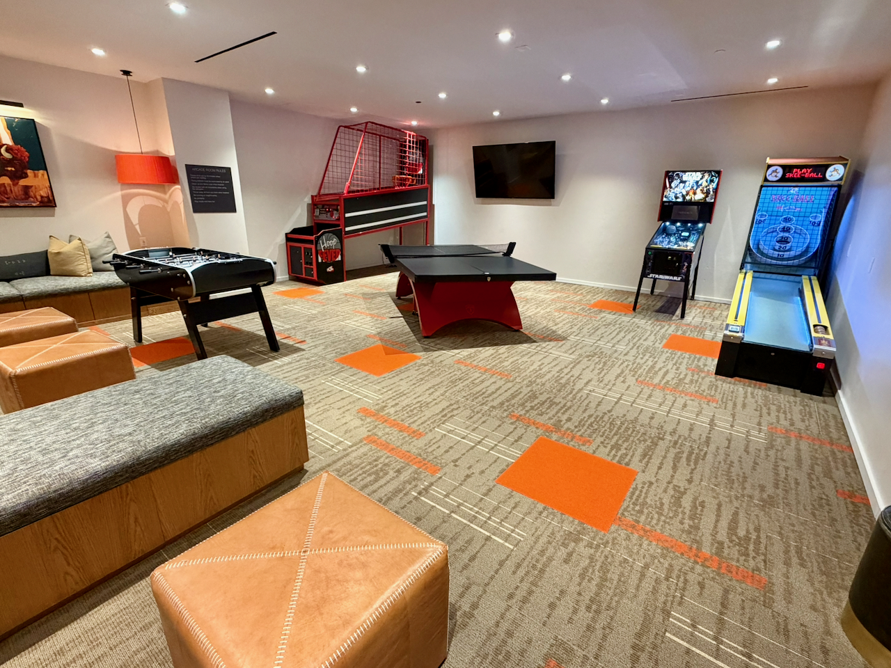 Teen game room with foosball, ping pong, Pop-A-Shot basketball, and Skee Ball. 