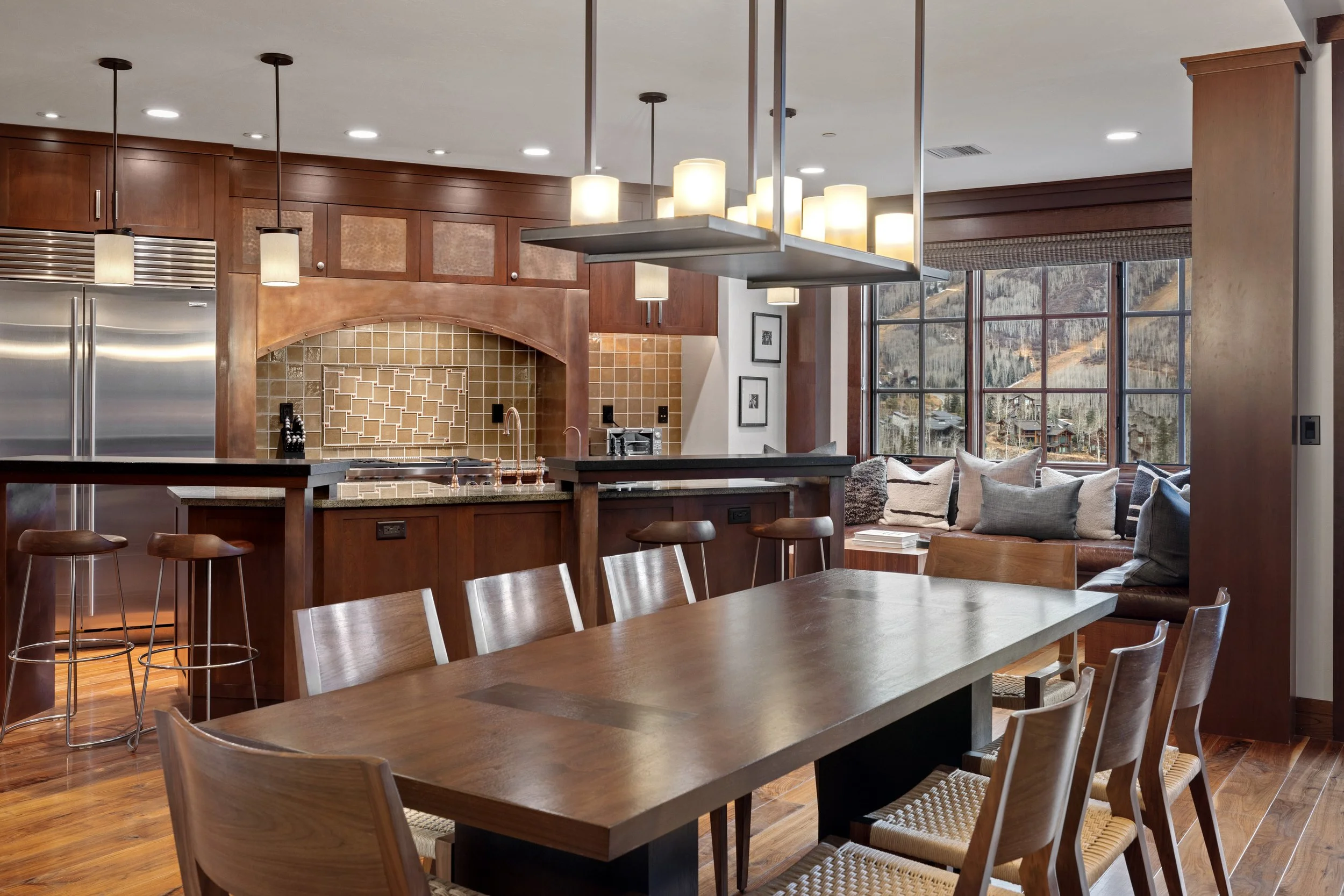 Dining table seats eight with four additional seats at the kitchen island