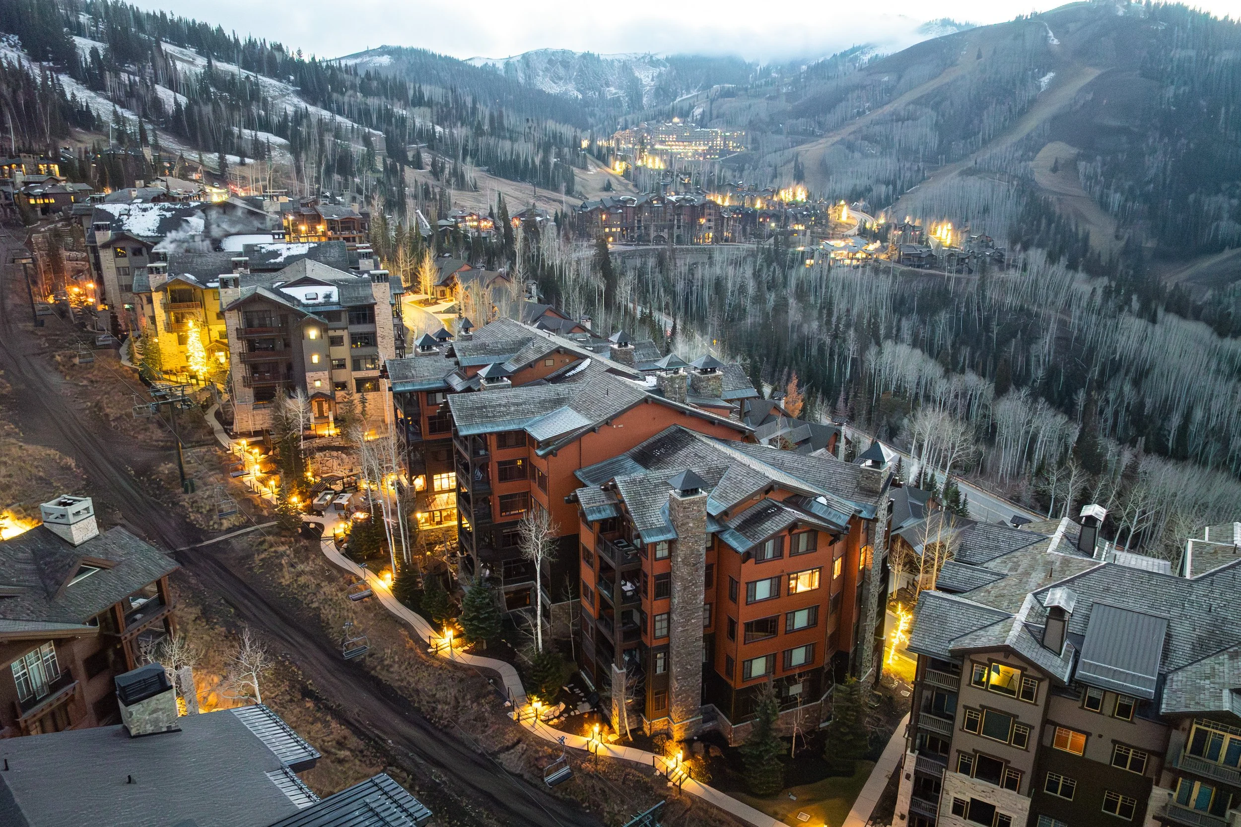 Flagstaff Lodge and Empire Pass village nestled against the mountain at dusk