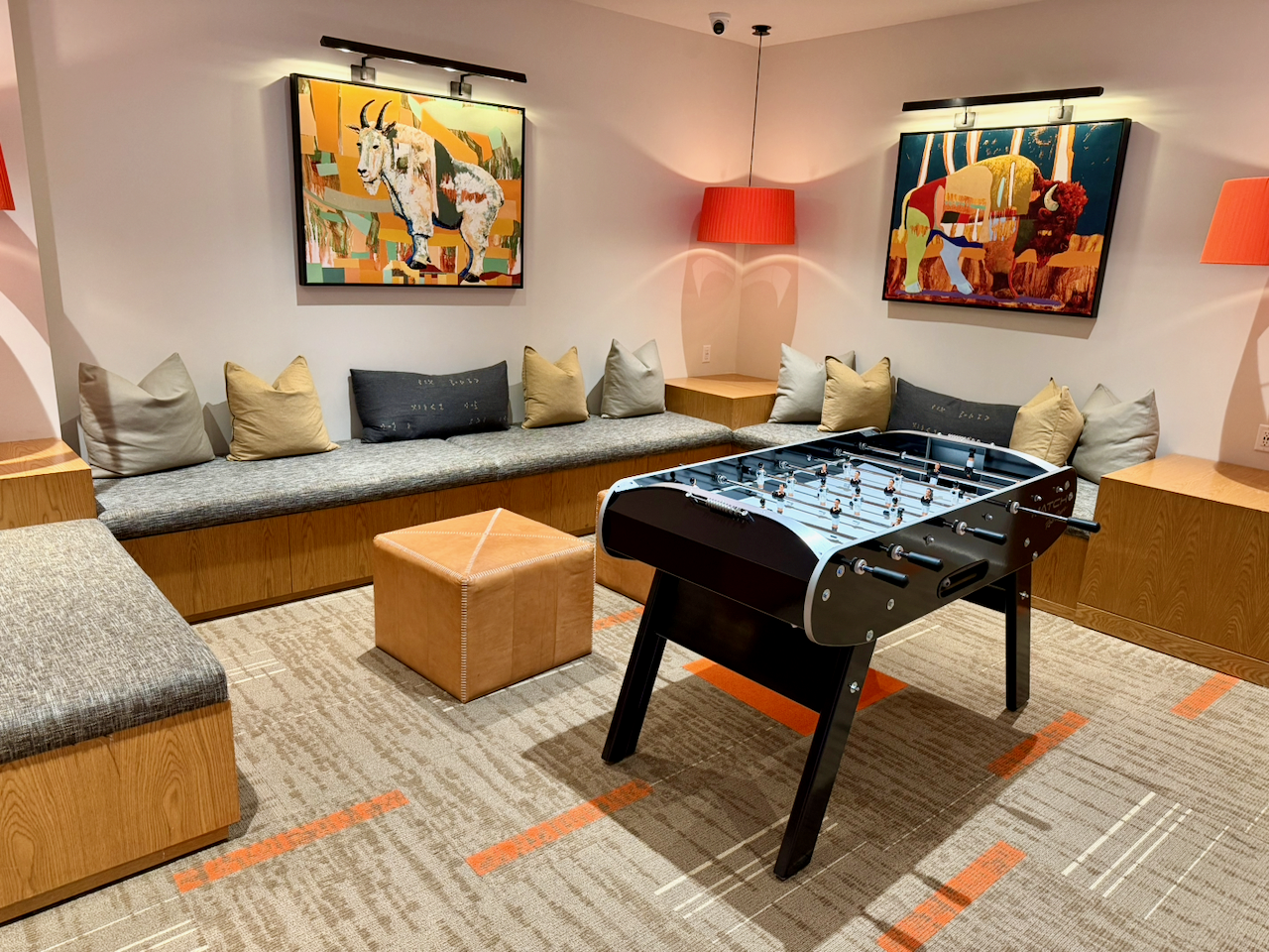 Foosball and lounge seating in the teen game room — a favorite hangout for all ages.